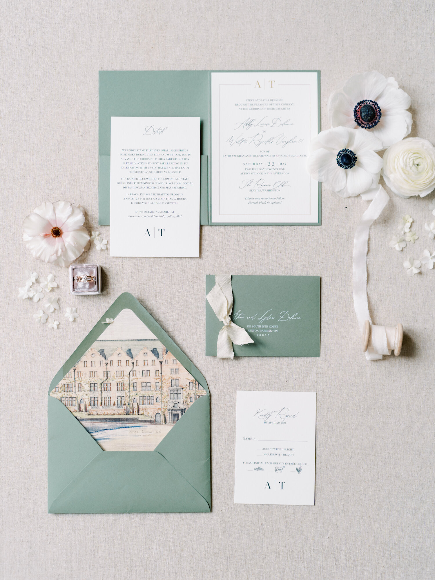 flat lay of sage and white wedding invitations