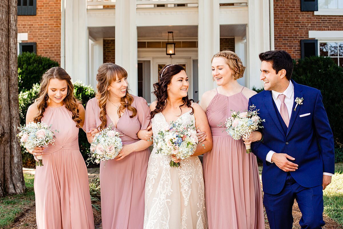 Bride strolling with her bridesmaids
