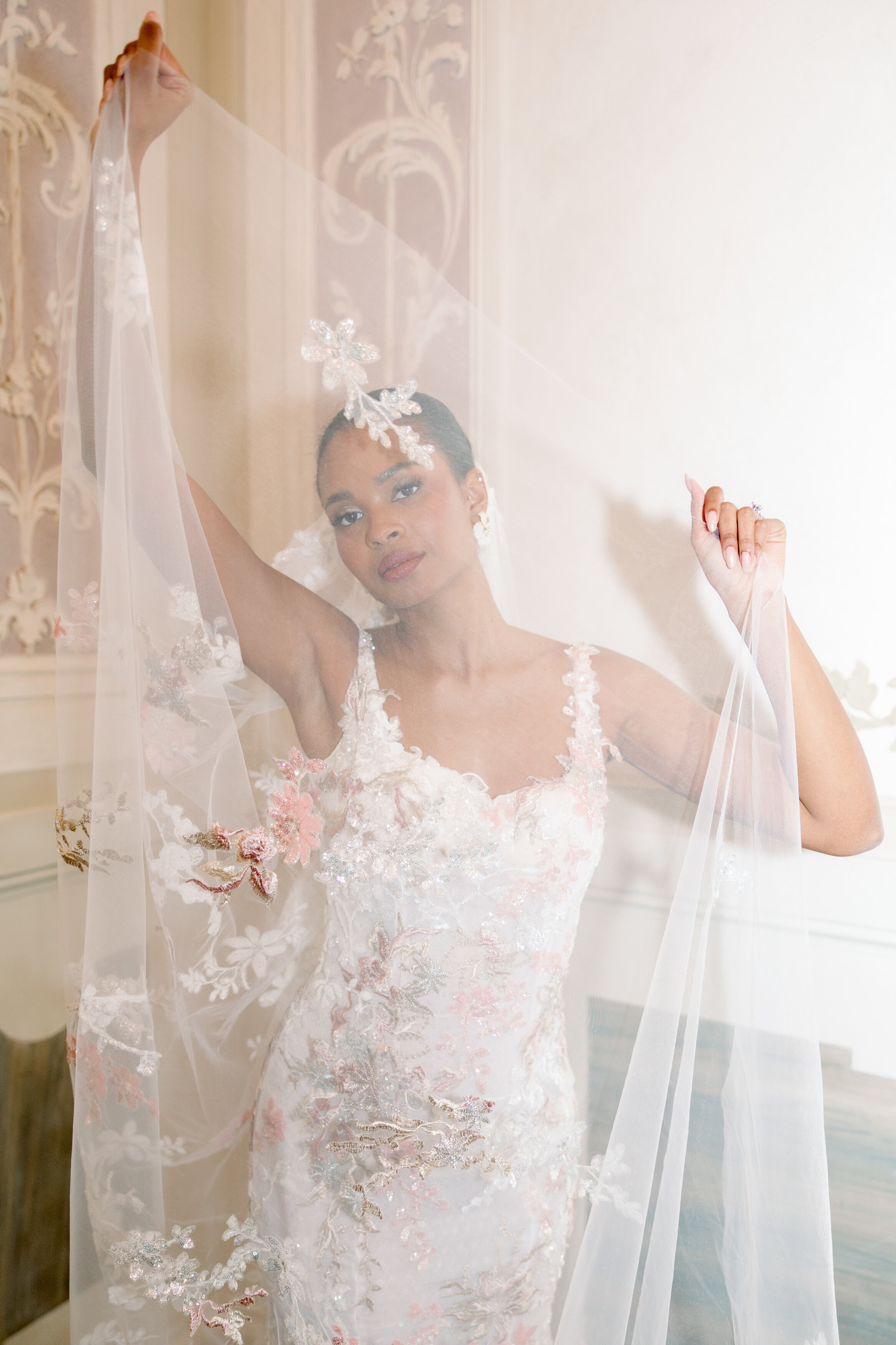 Wedding and Elopement Photographer, bride posing with veil over her head