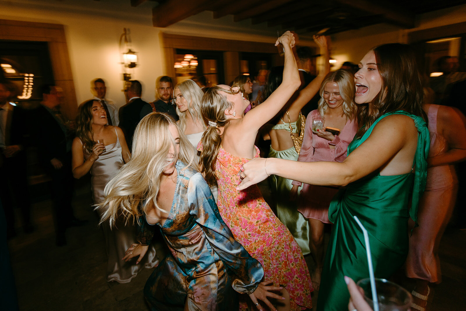Guests dancing at the reception, living their best life.