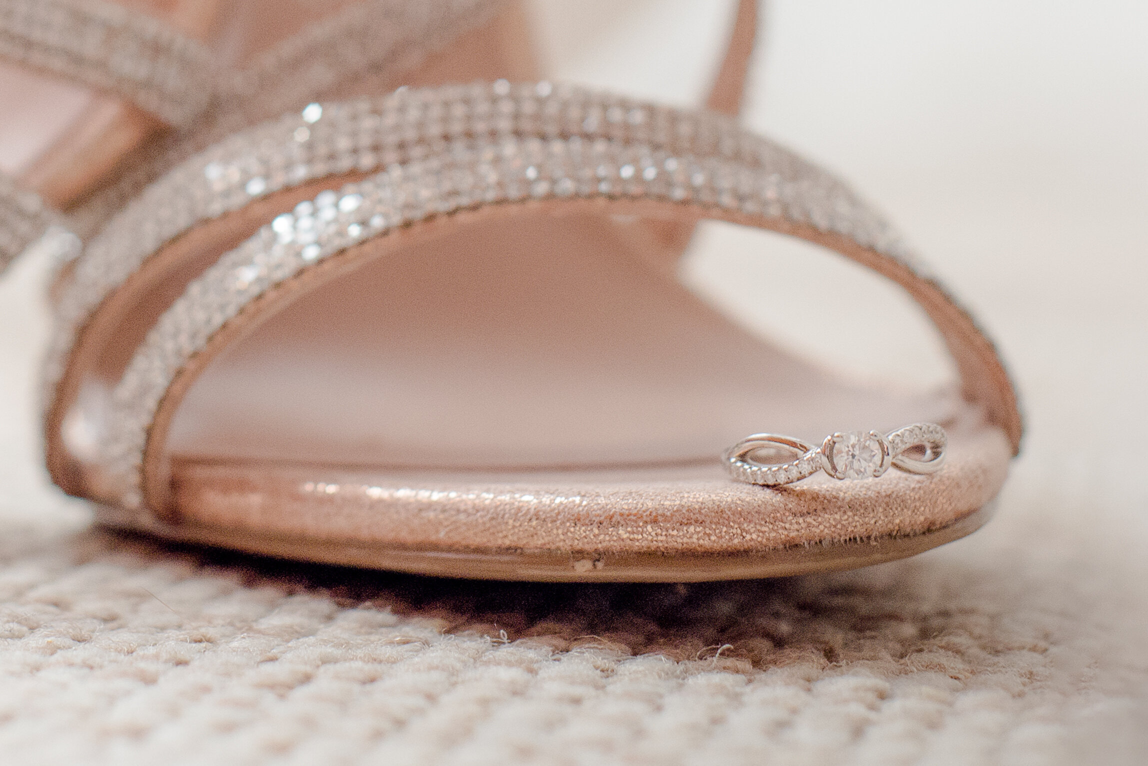 detail shot of wedding shoes and ring