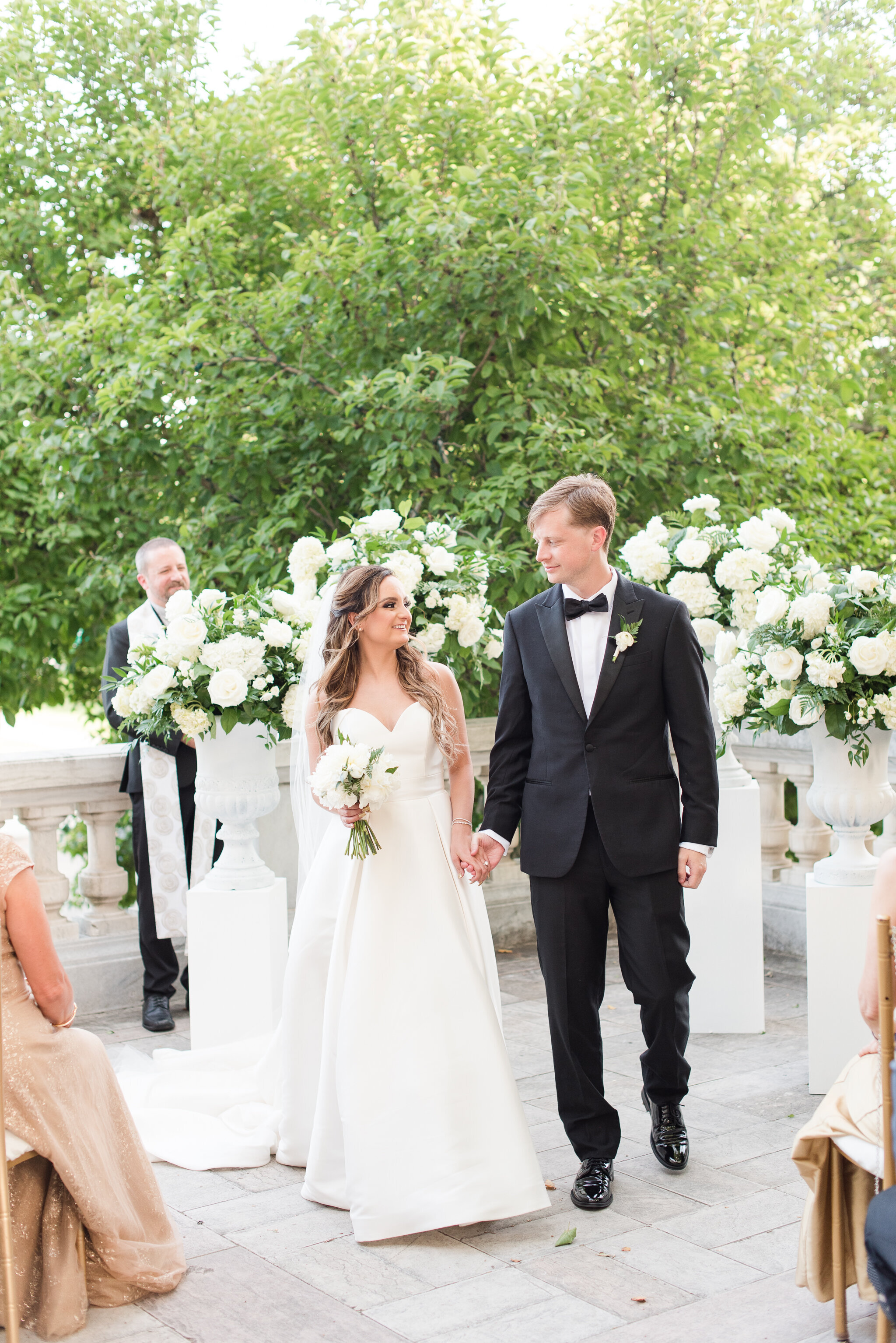 couple walking after wedding ceremony at dar wedding in dc