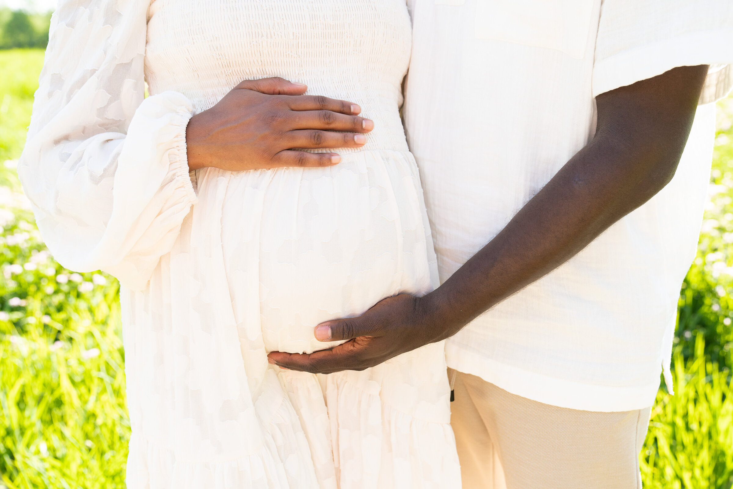 Couple holds the woman's baby belly