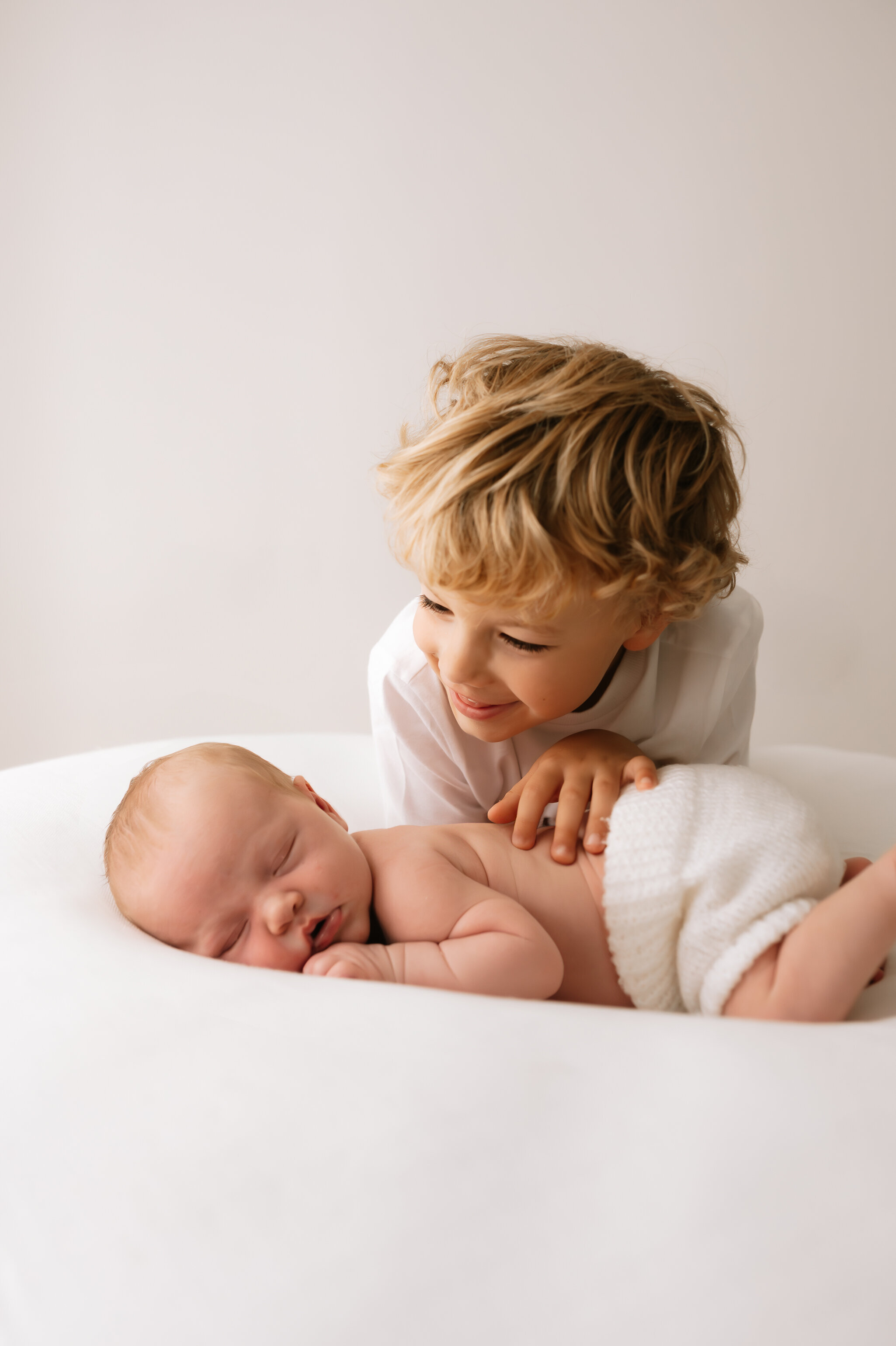 newborn girl, big brother and family at their newborn photography shoot in york, north yorkshire-43