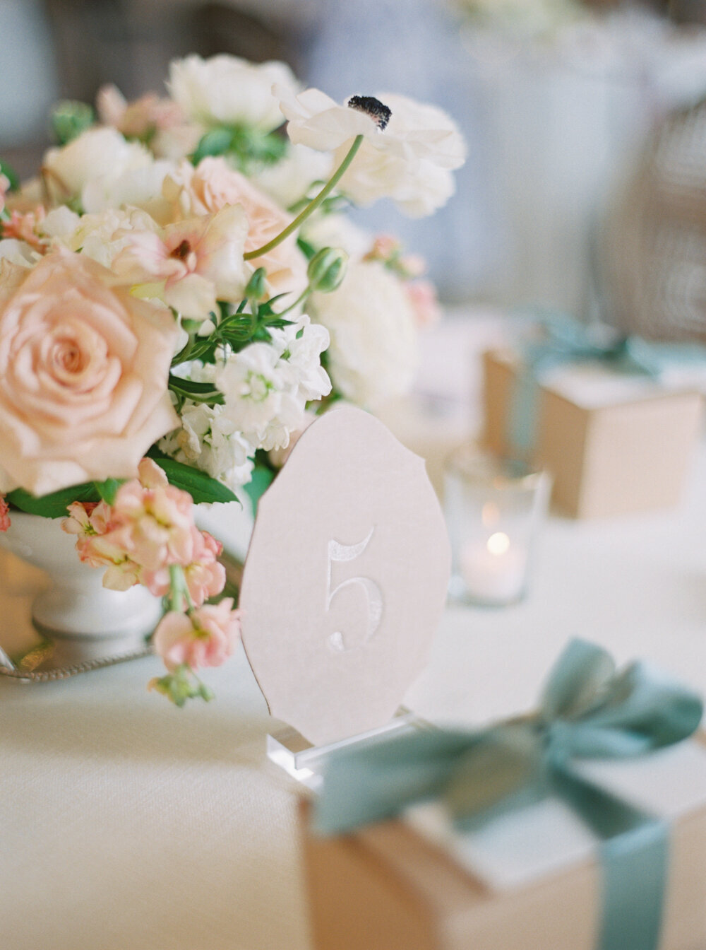 spring sage and peach wedding table decor with velvet raptor table numbers