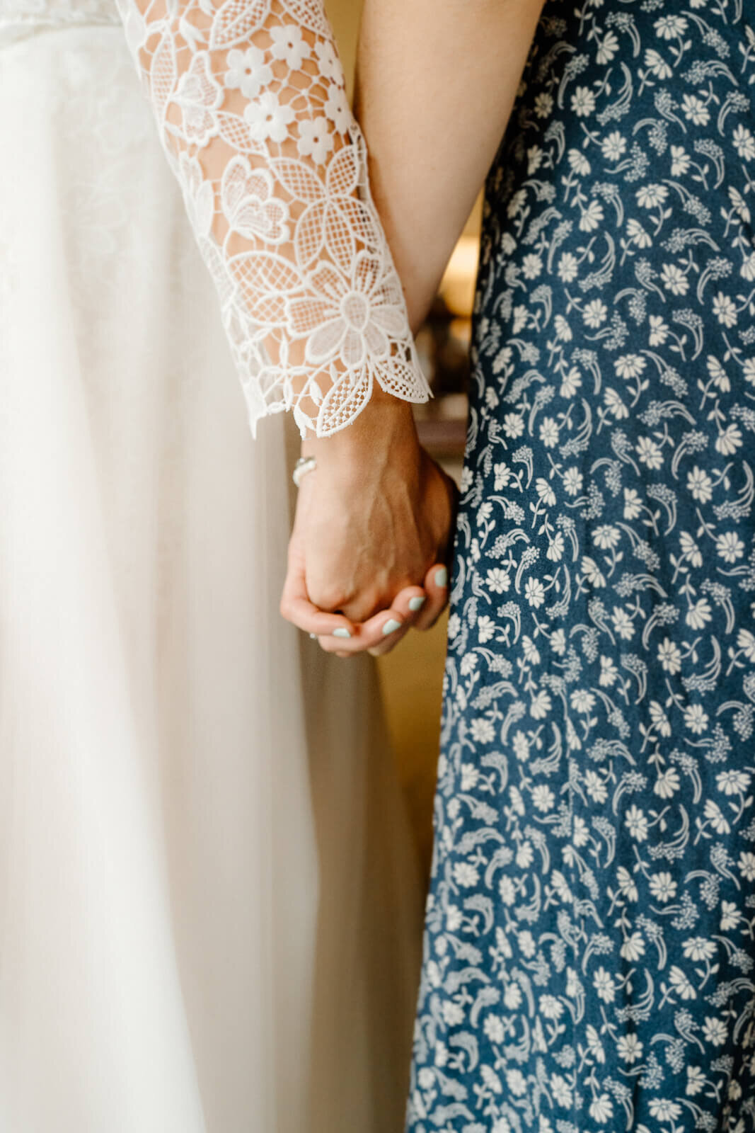 Close up of hands - bride and maid of honor