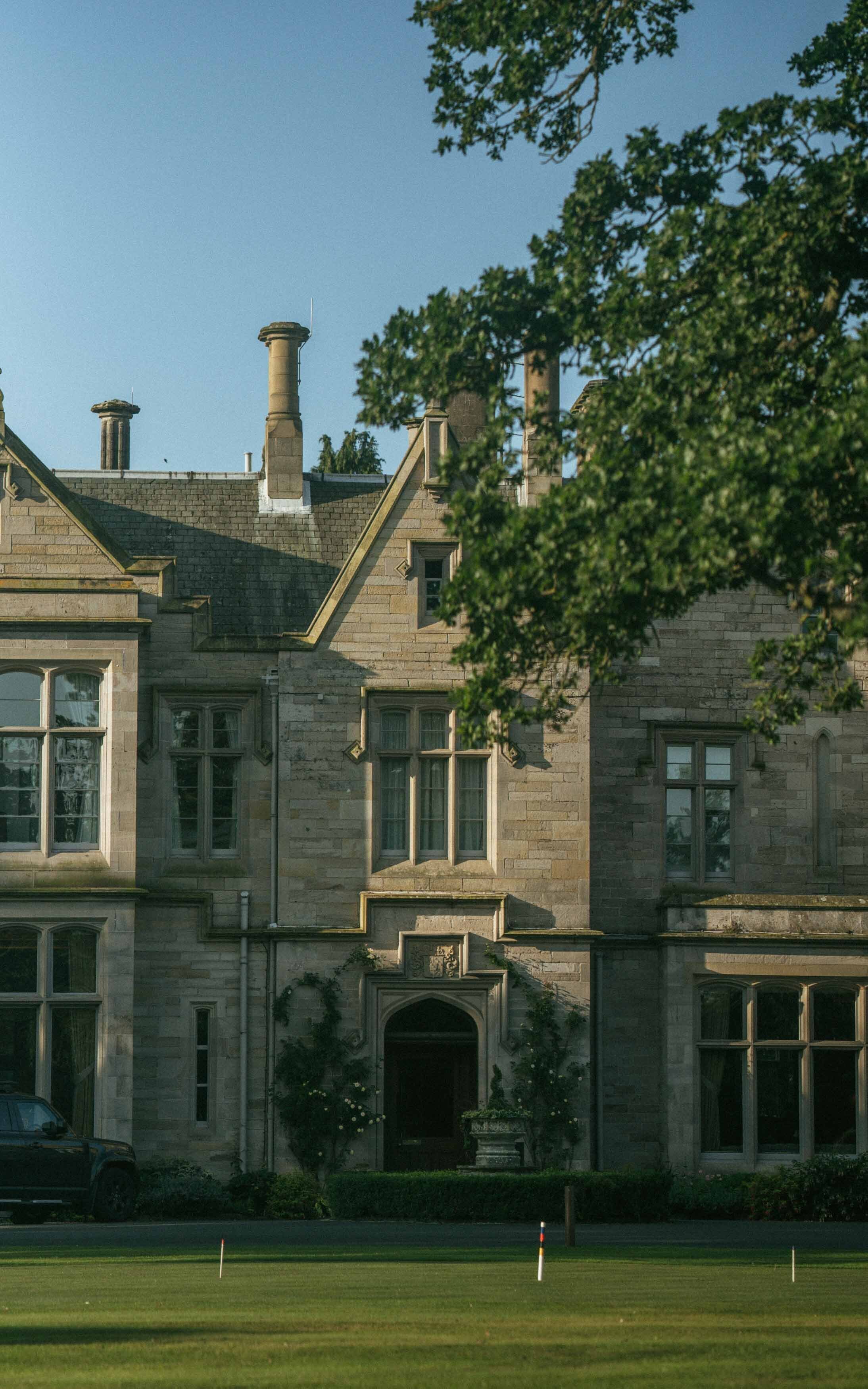 A stunning photo of Schloss in Kelso, highlighting its magnificent architecture and beautiful landscape in a serene setting