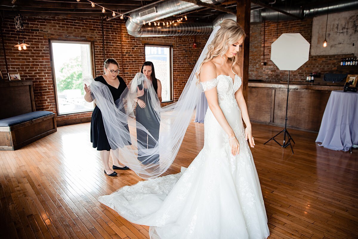 Ivory Door Studio helping bride with her cathedral veil