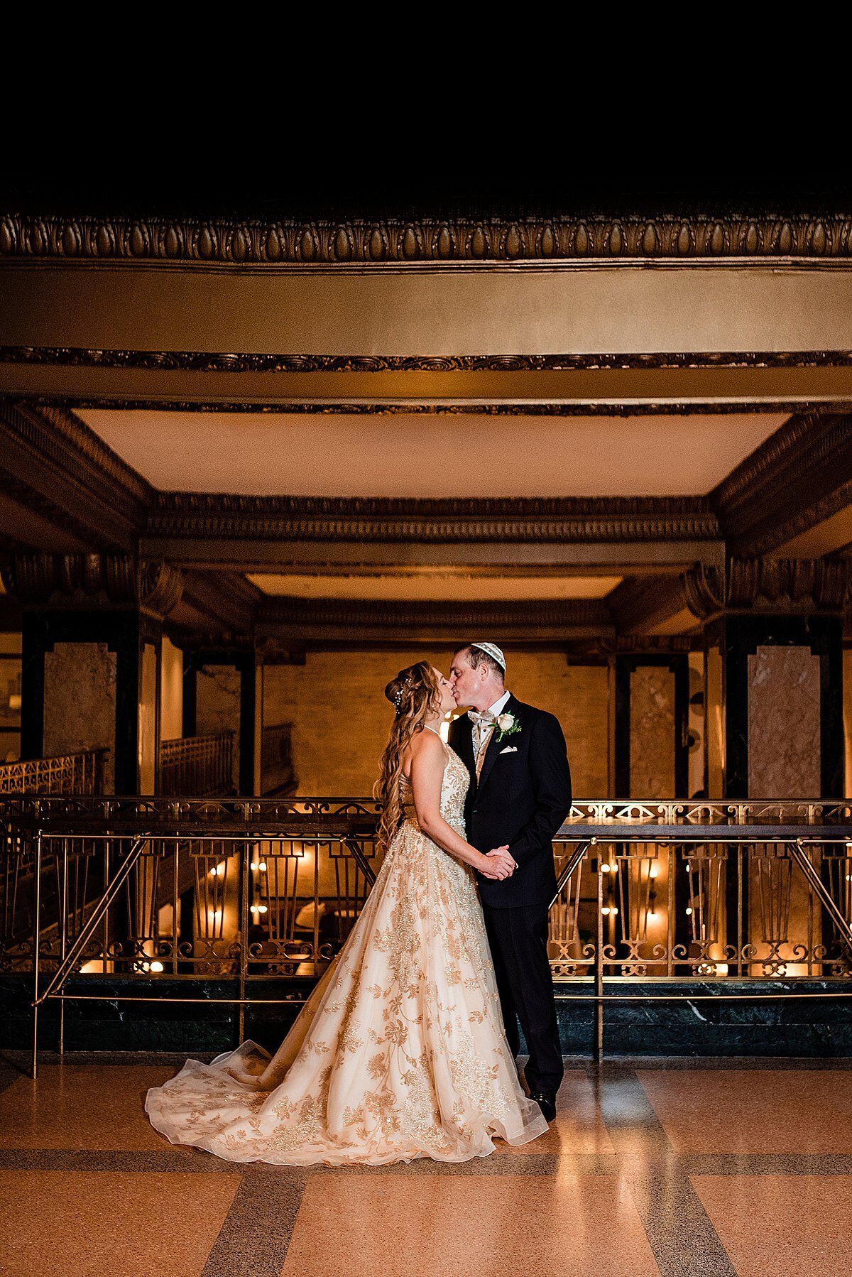Dramatic gold and ivory wedding portrait on the 2nd floor of the historic Noelle Nashville building