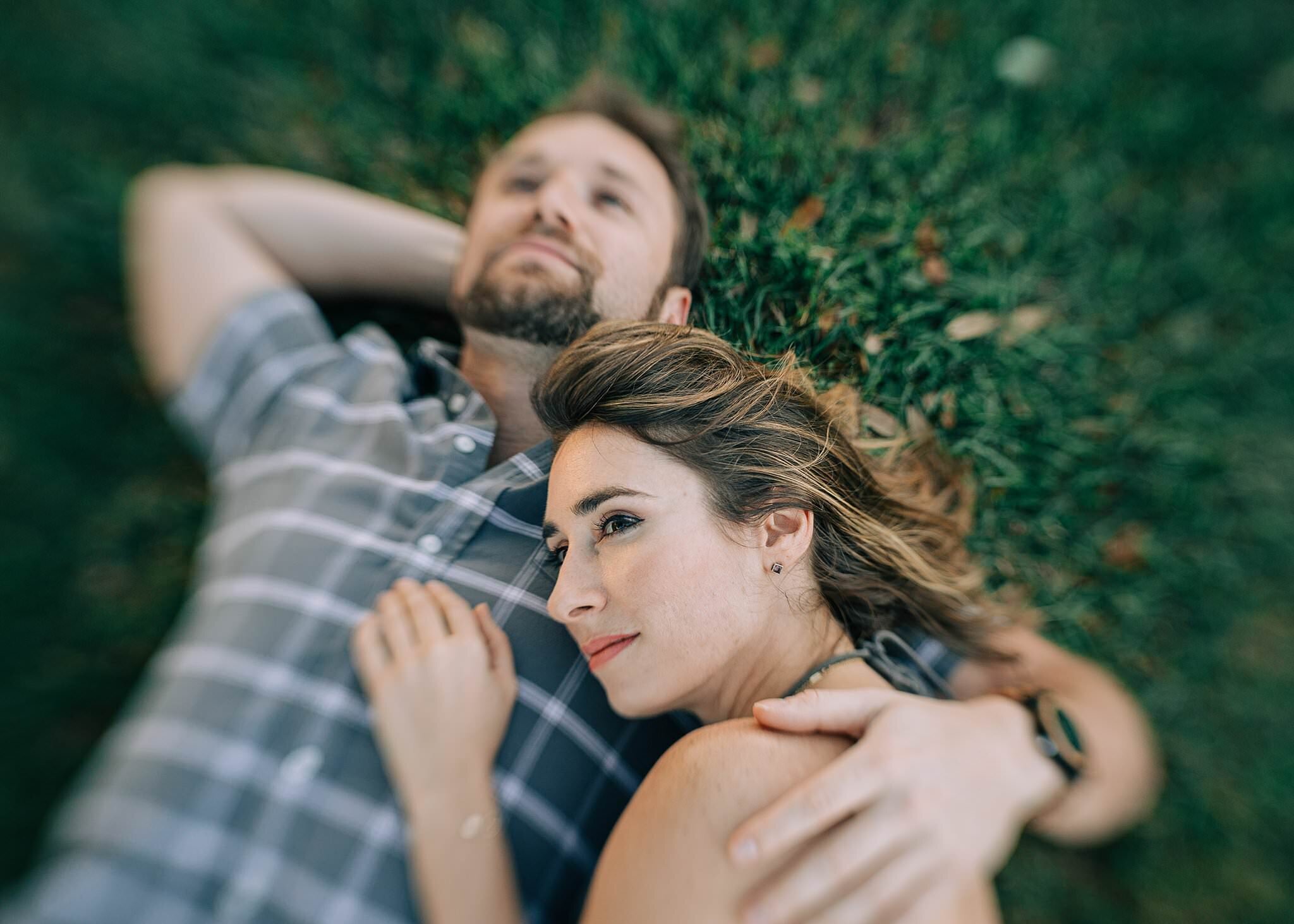Couple lying on the grass, dreamy