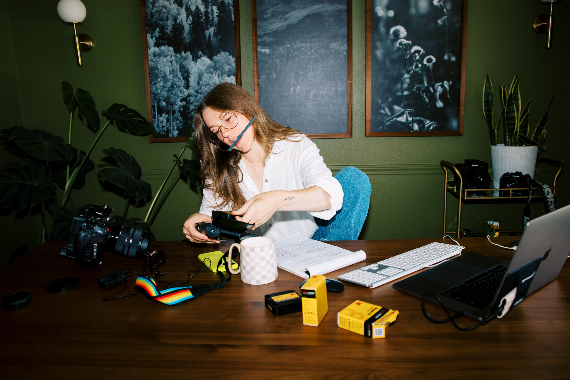 videographer putting film in super 8 camera