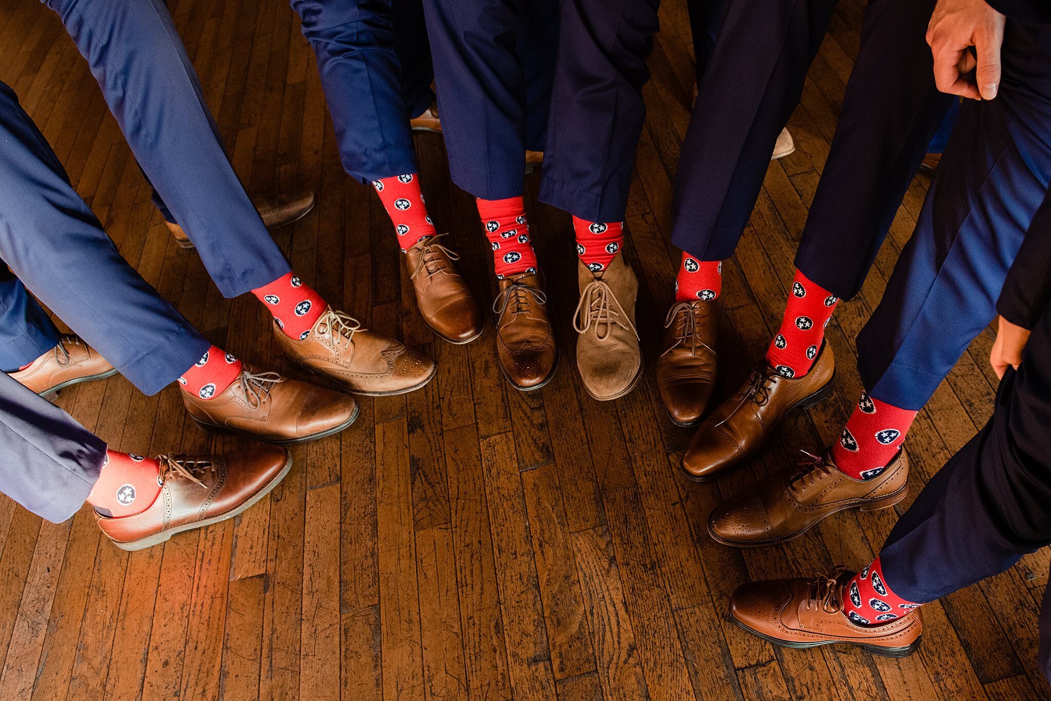 Detail photo of groomsmen wearing tri-star Tennessee state socks and brown shoes