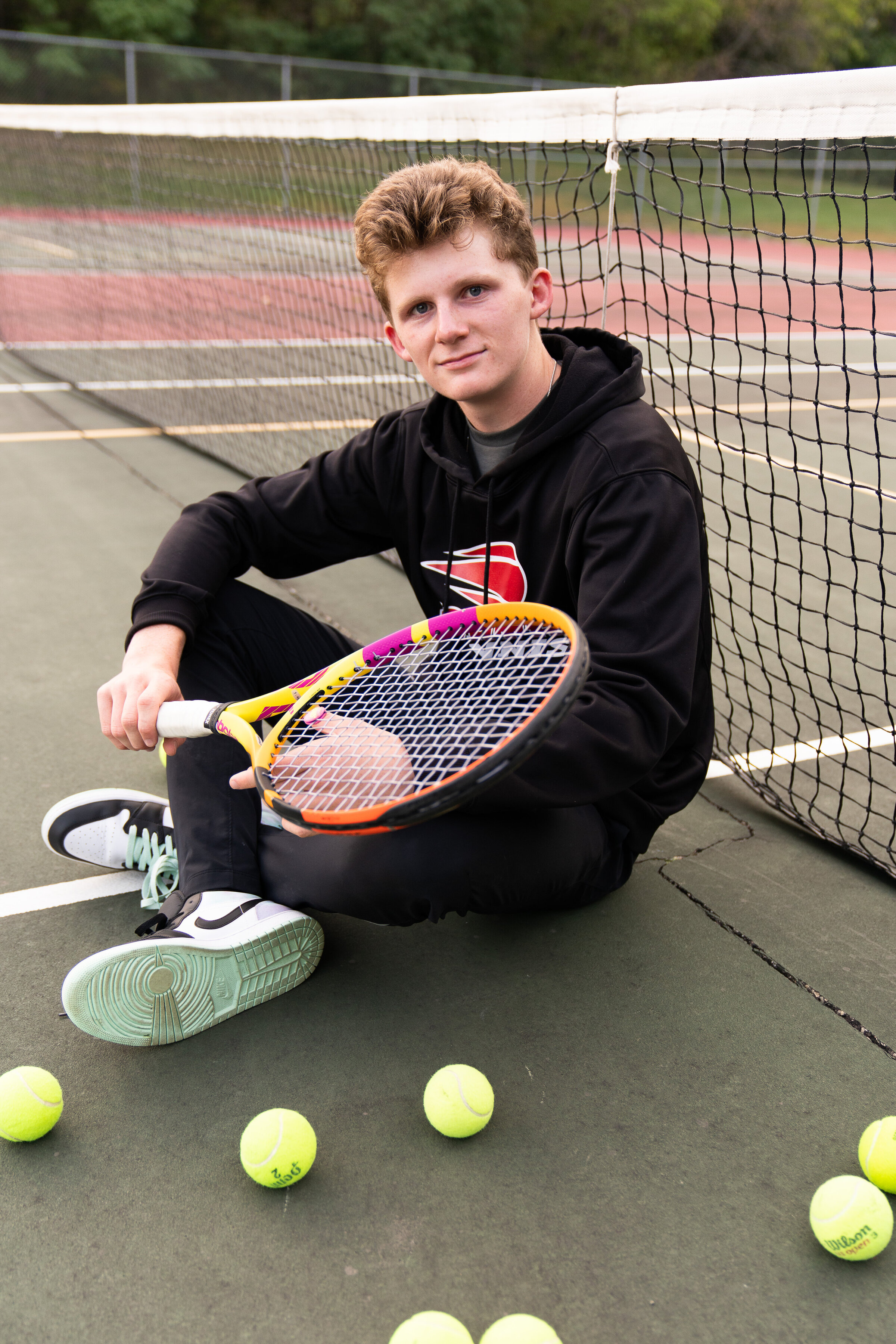 Senior pictures at a tennis court in Lakeville, Minnesota