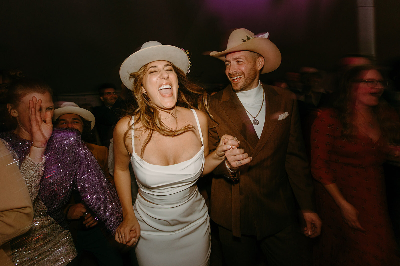 A bride and groom dancing to a live band at rancho pillow wedding venue.