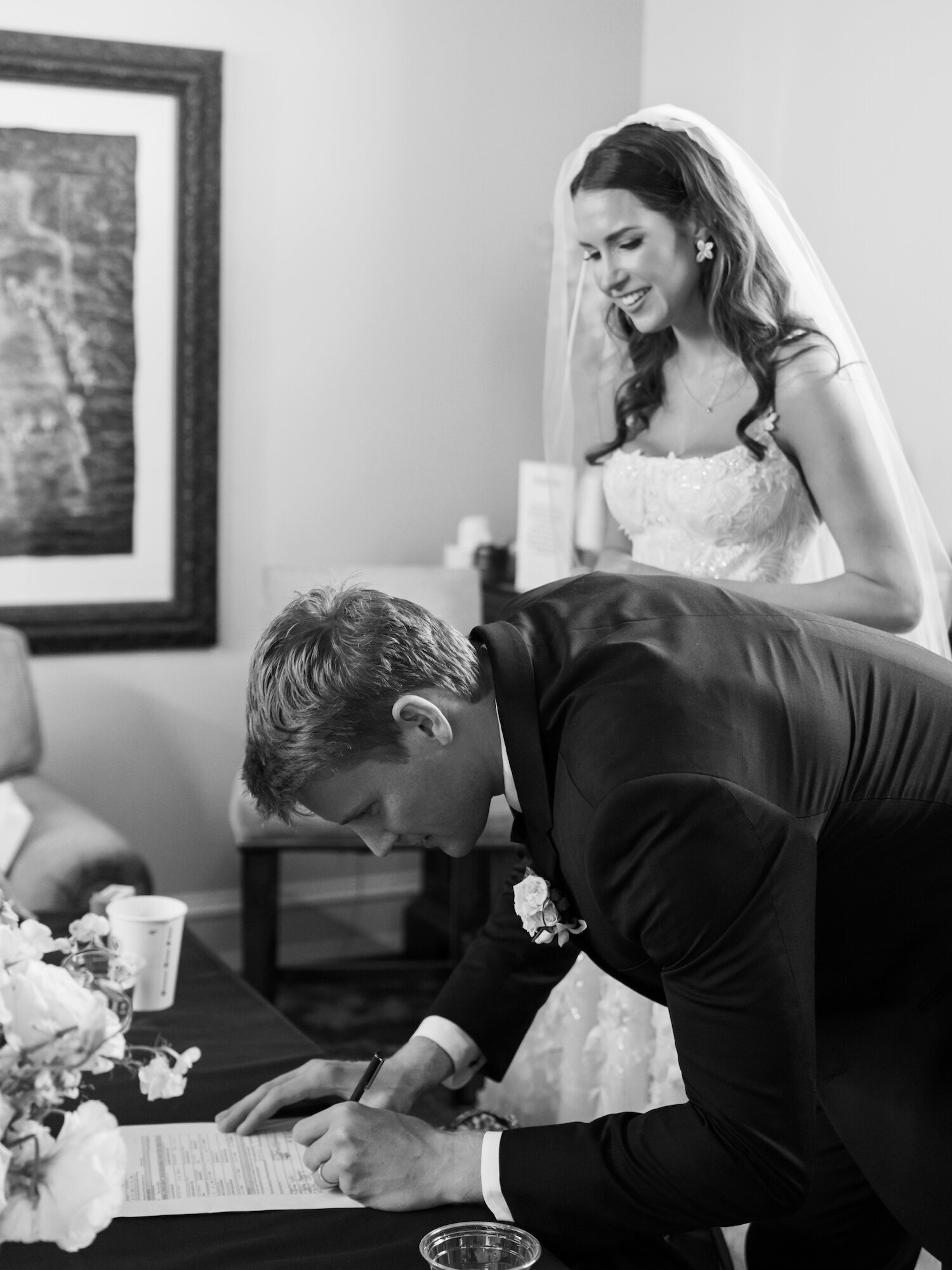 groom signing the marriage license