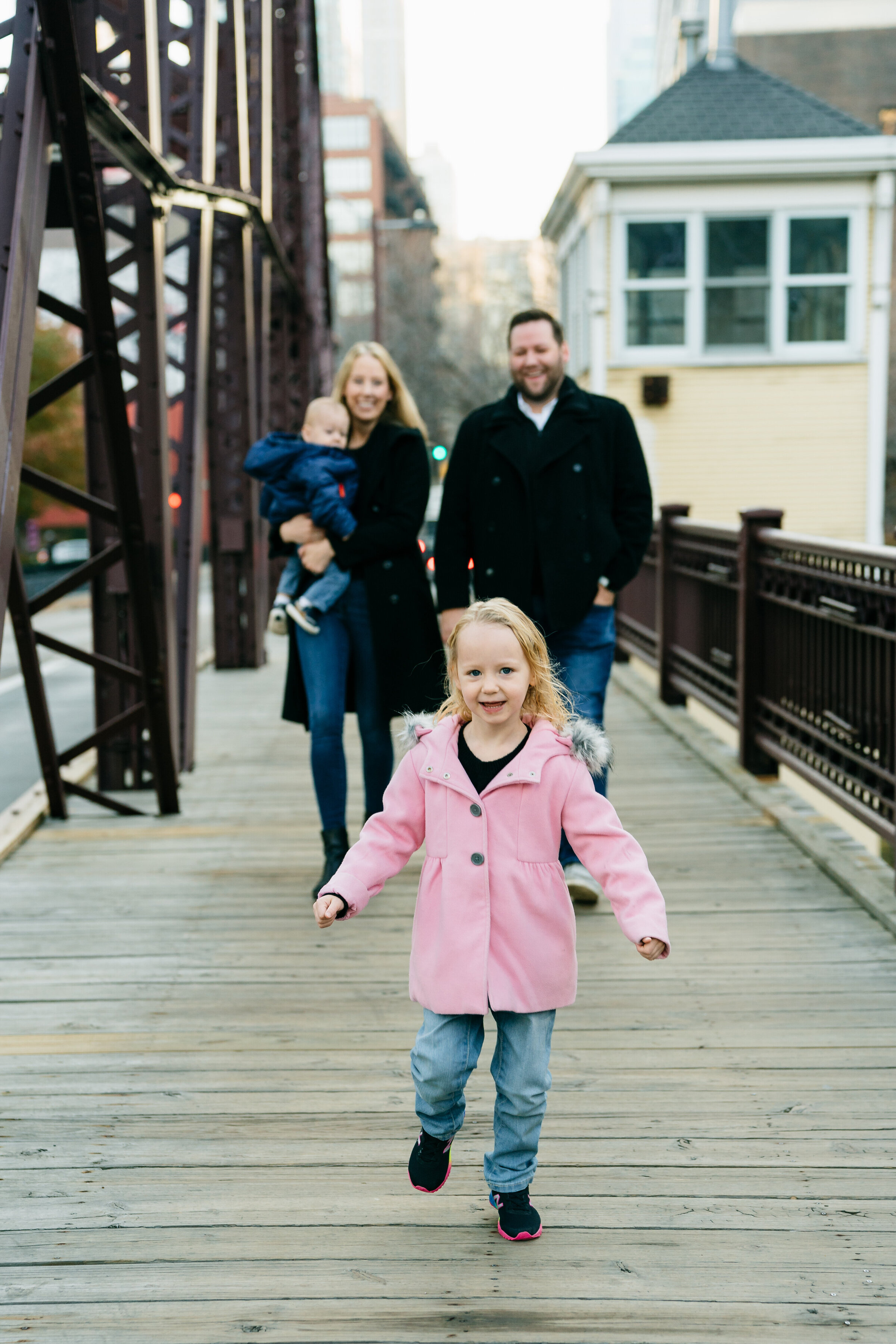 Family photoshoot on Kinzie Street Bridge crossing the Chicago River