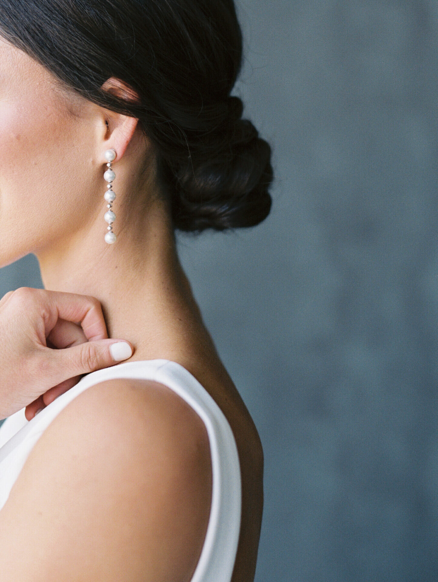 long drop pearl earrings on a bride