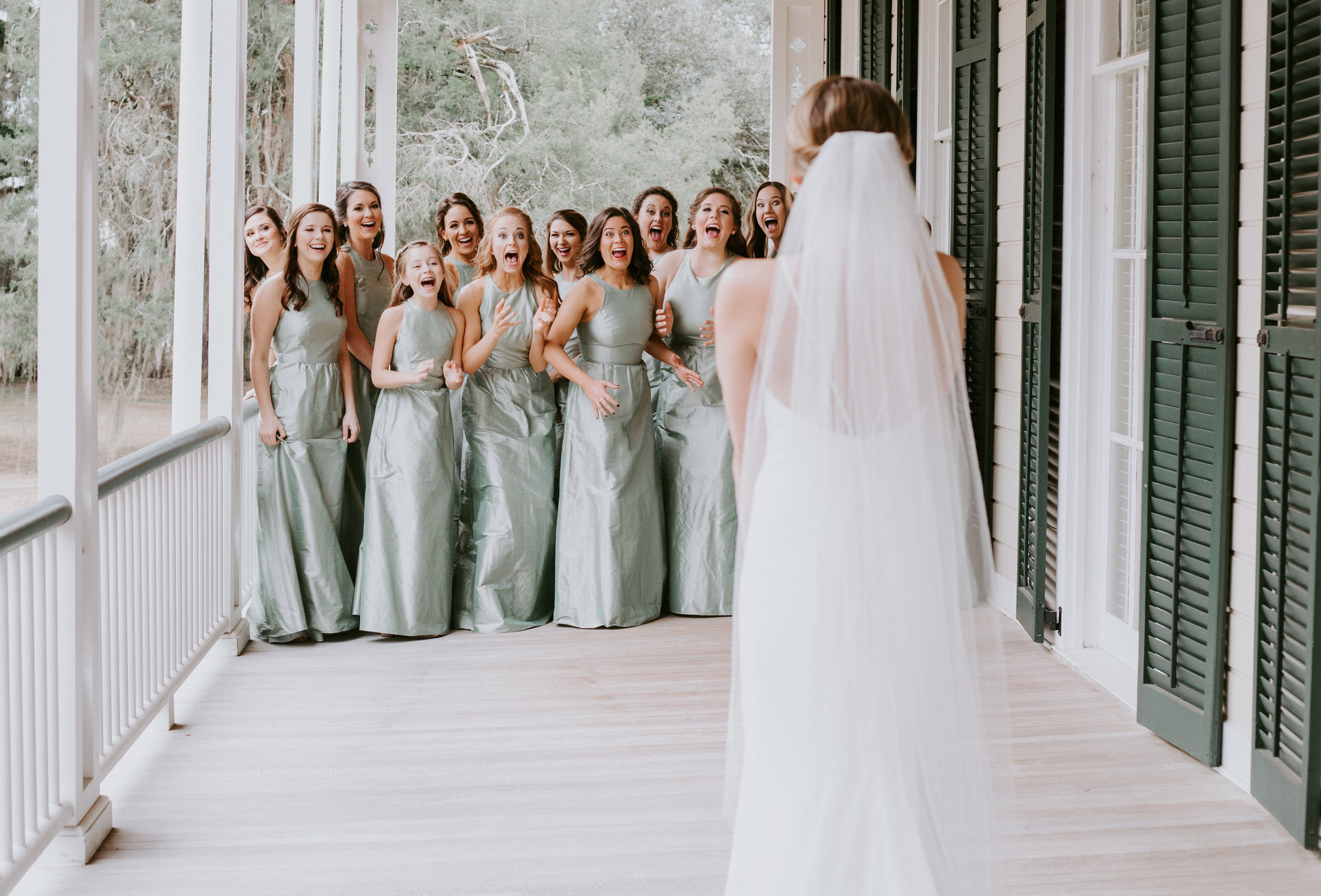 brides first look with her bridesmaids on her wedding day in savannah georgia