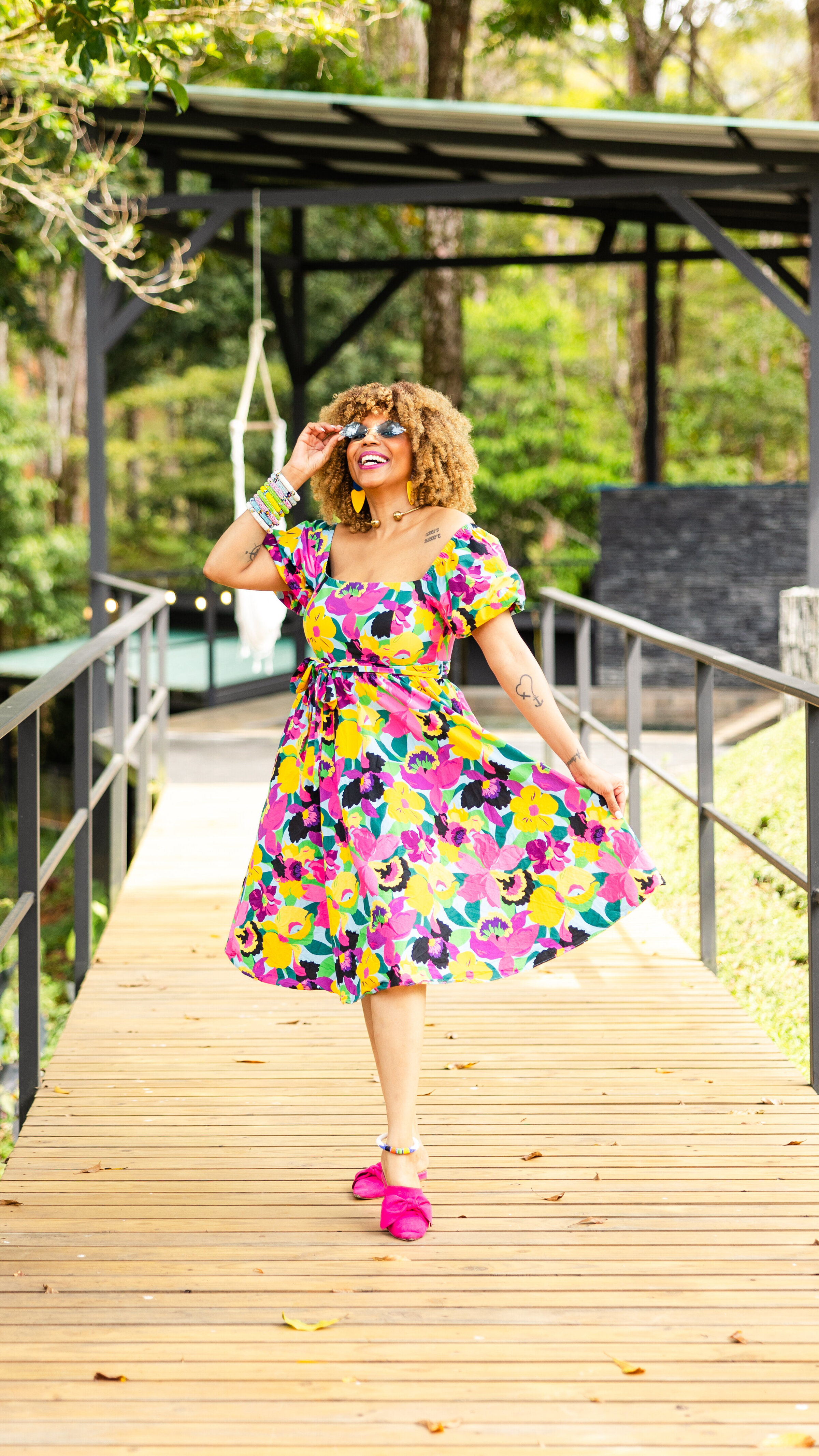 woman walking down a runway in the jungle