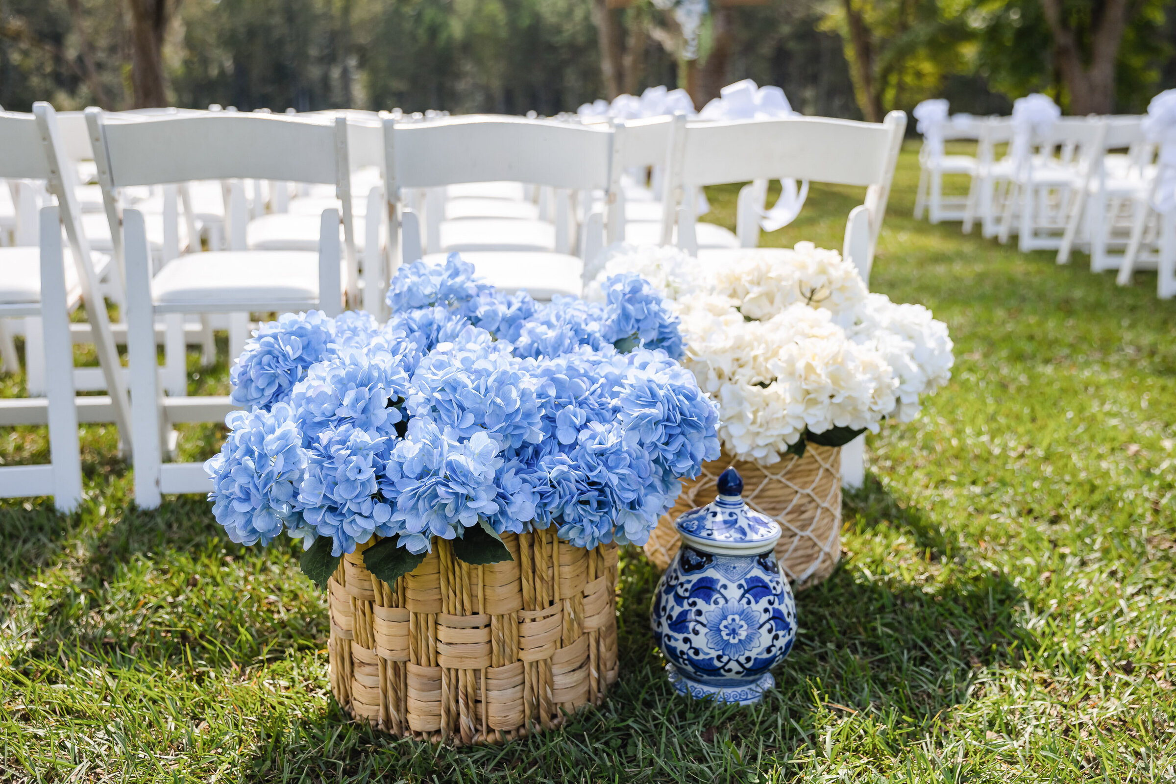 "Blue and white flowers at wedding ceremony at Lucas Farms NC"