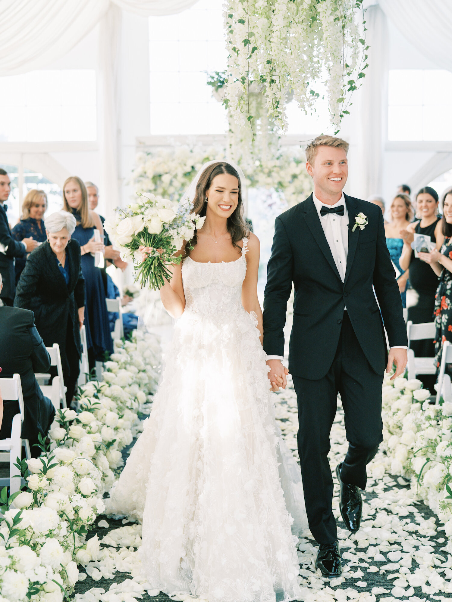 wedding bride and groom processional white roses everywhere