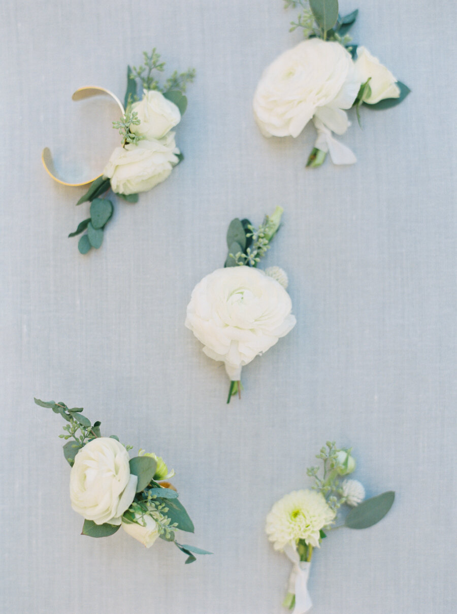 white rose with eucalyptus boutonnières