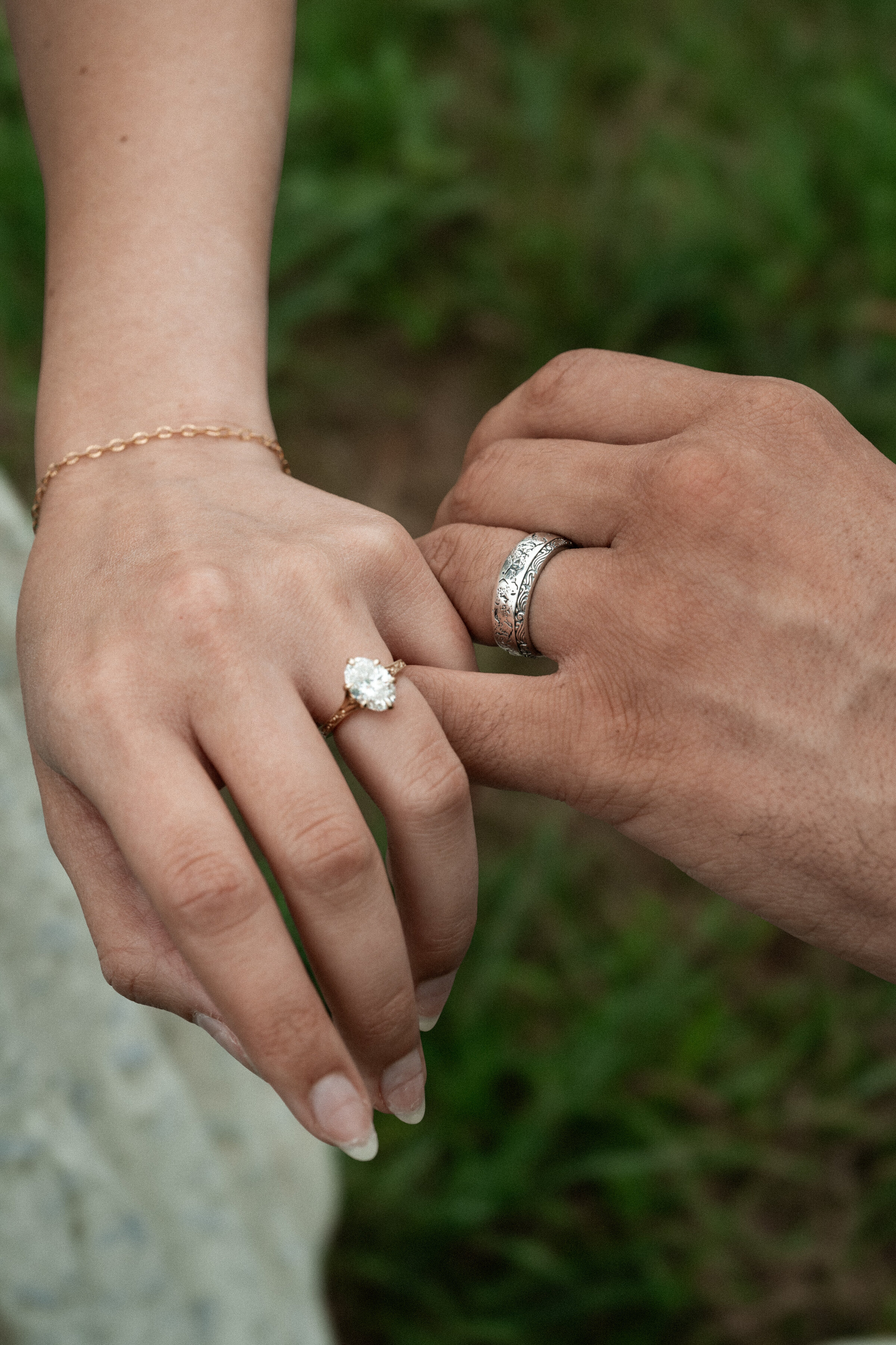 close up of couples rings during engagement session