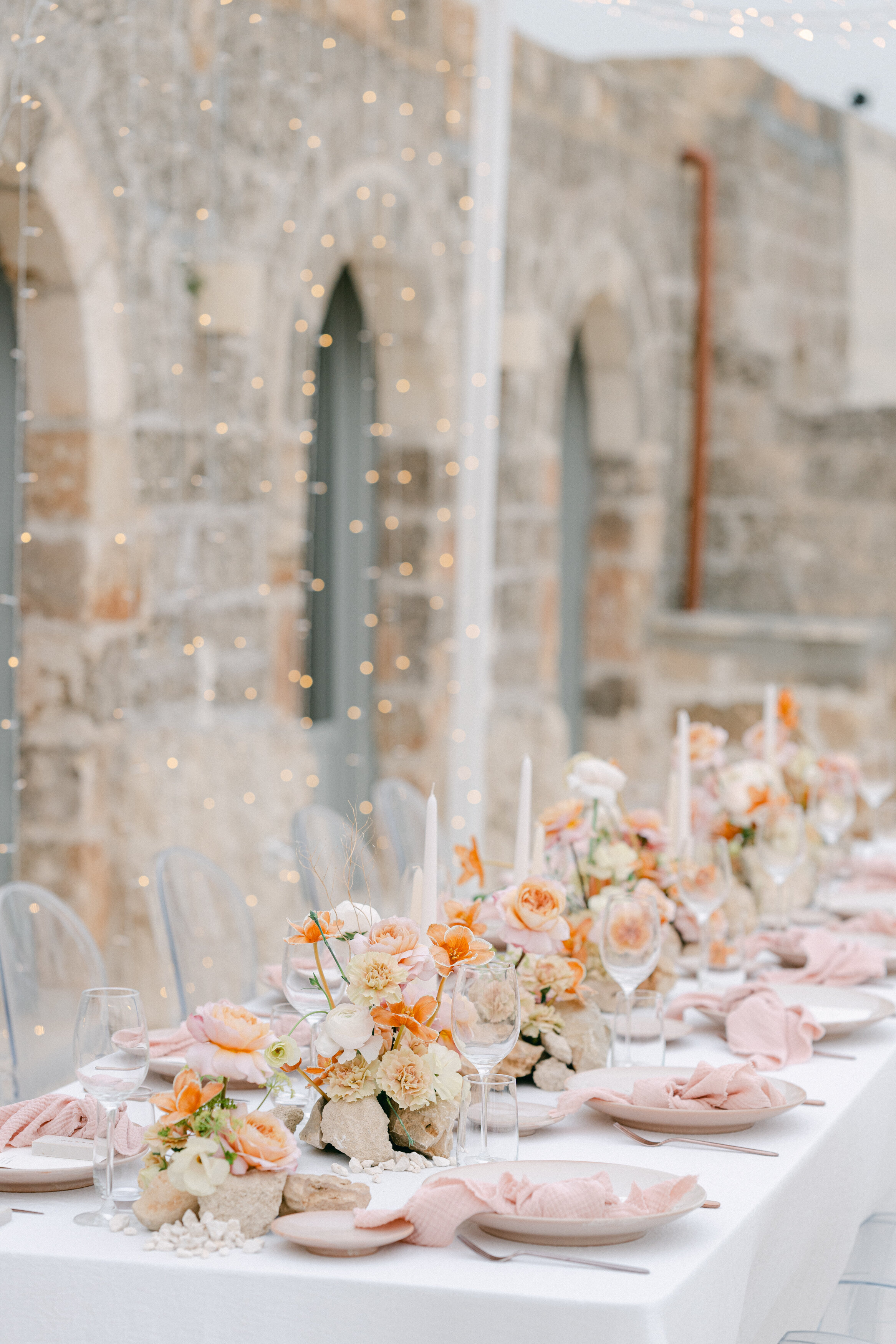 Wedding and Elopement Photographer, looking across table setting at reception