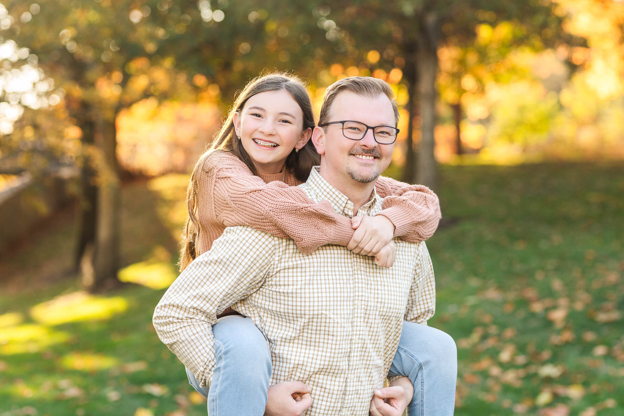 A stunning family session at North Bank Park in downtown Columbus, Ohio, with the city skyline as a picturesque backdrop