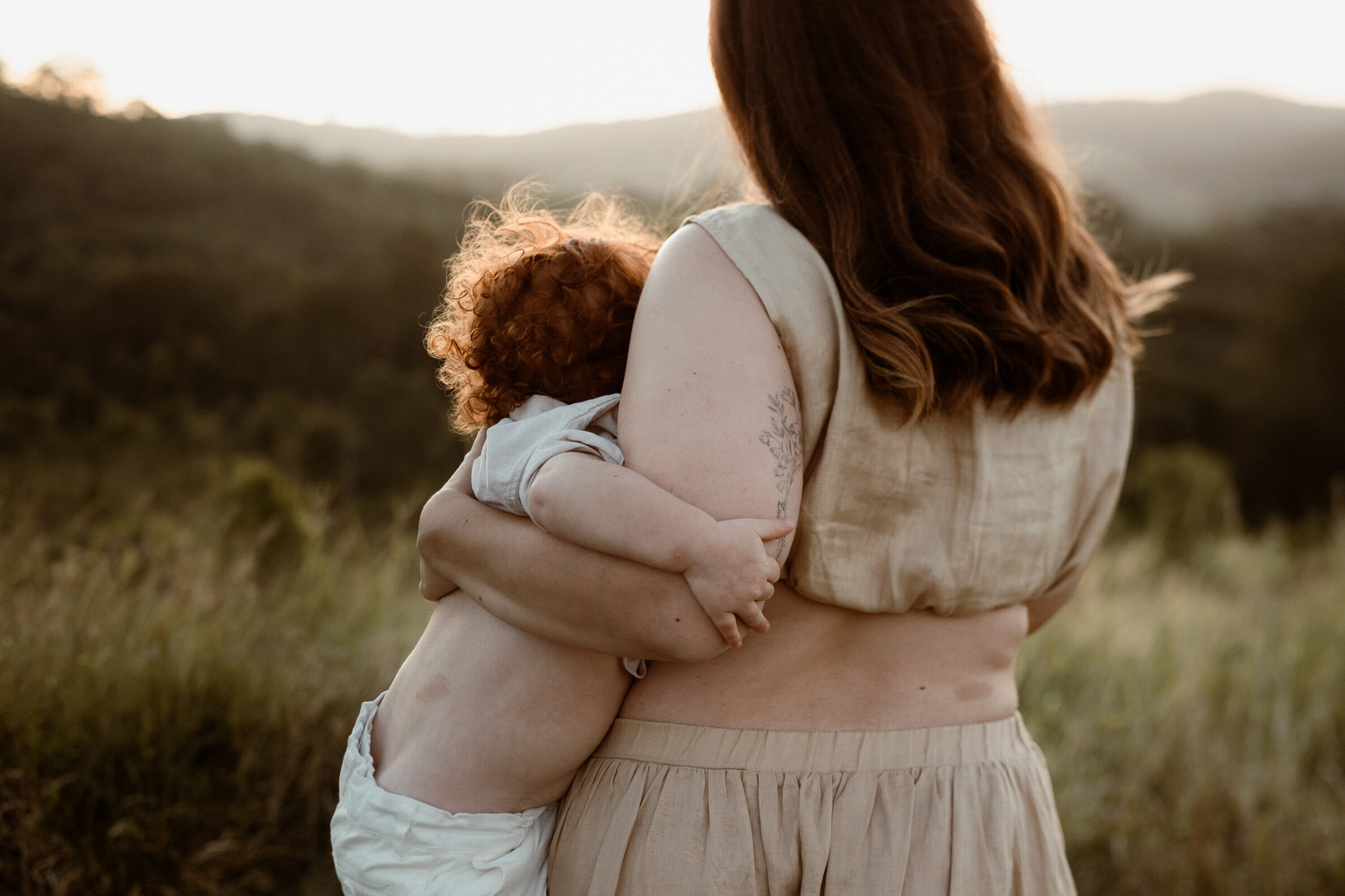 Mother and son with matching birthmarks, standing at Ormeau fields