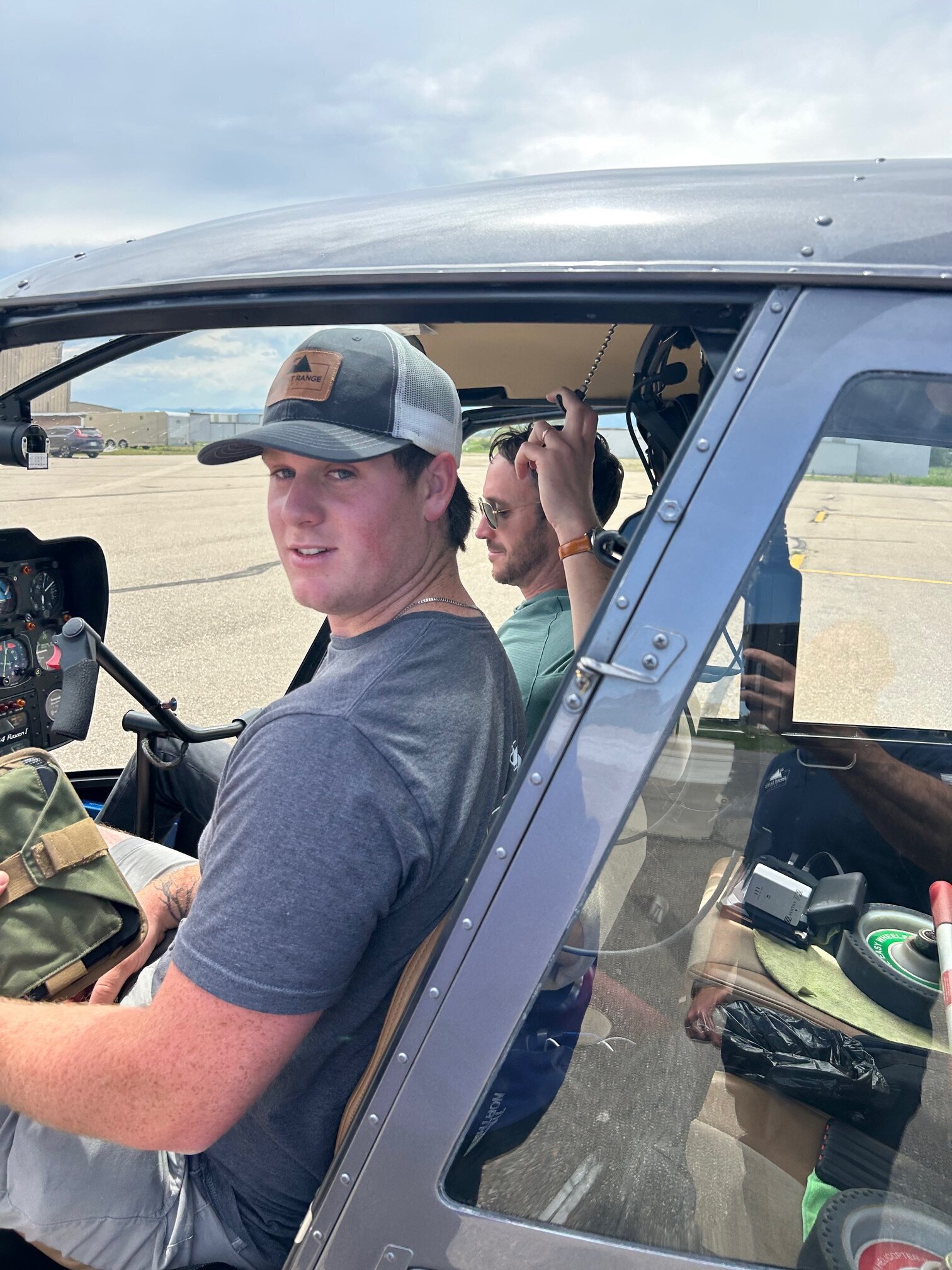 helicopter pilot wesley carse working with a flight training student
