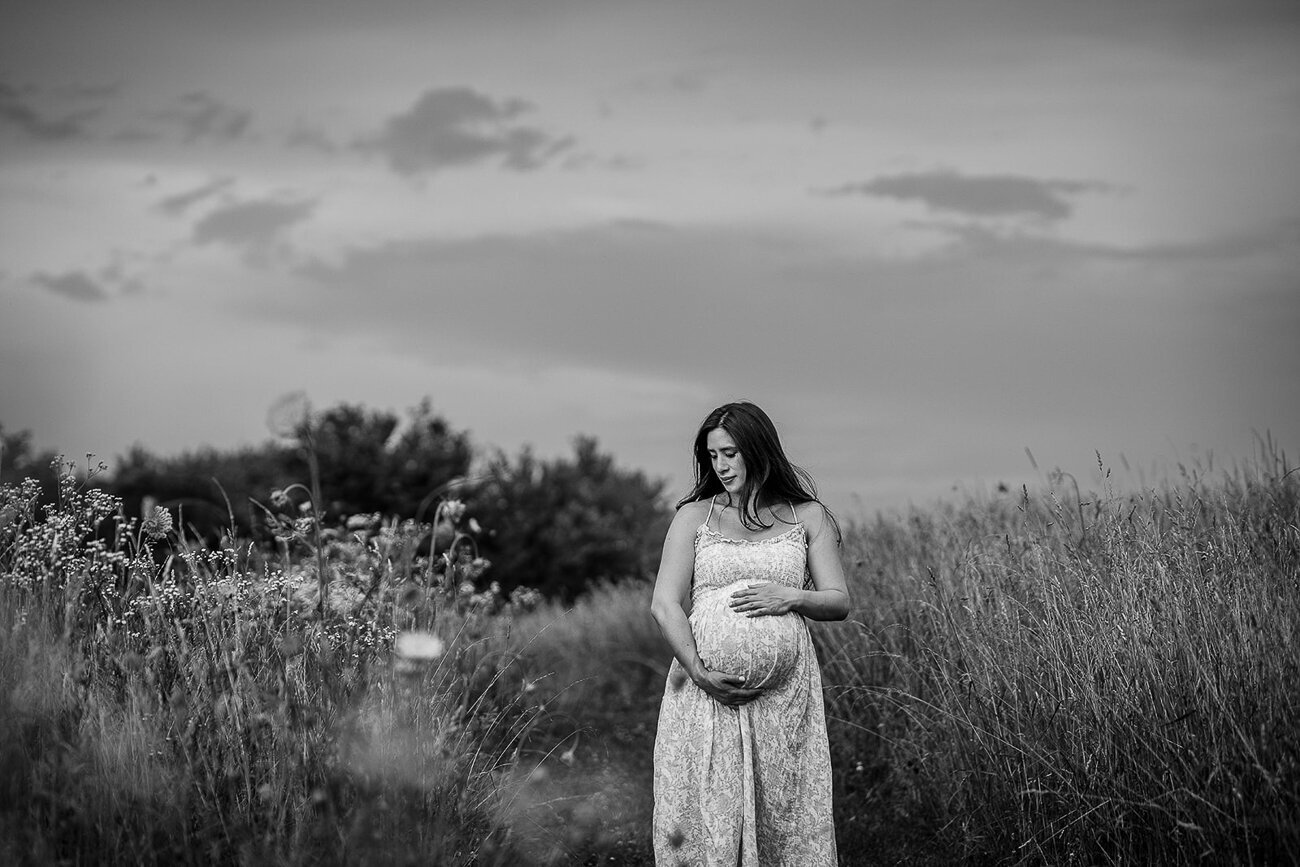 black and white maternity portrait in a boston field