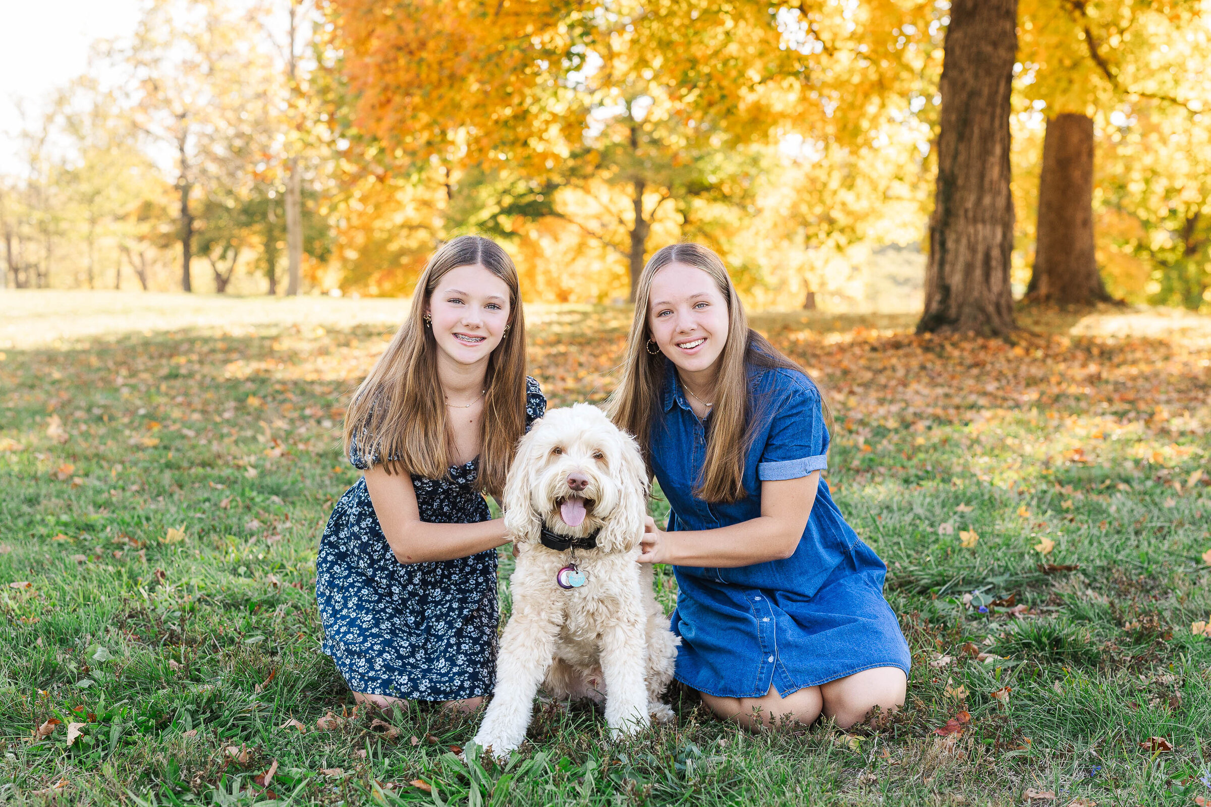 A cozy autumn family session with a dog at Griggs Reservoir, featuring warm fall colors and natural smiles