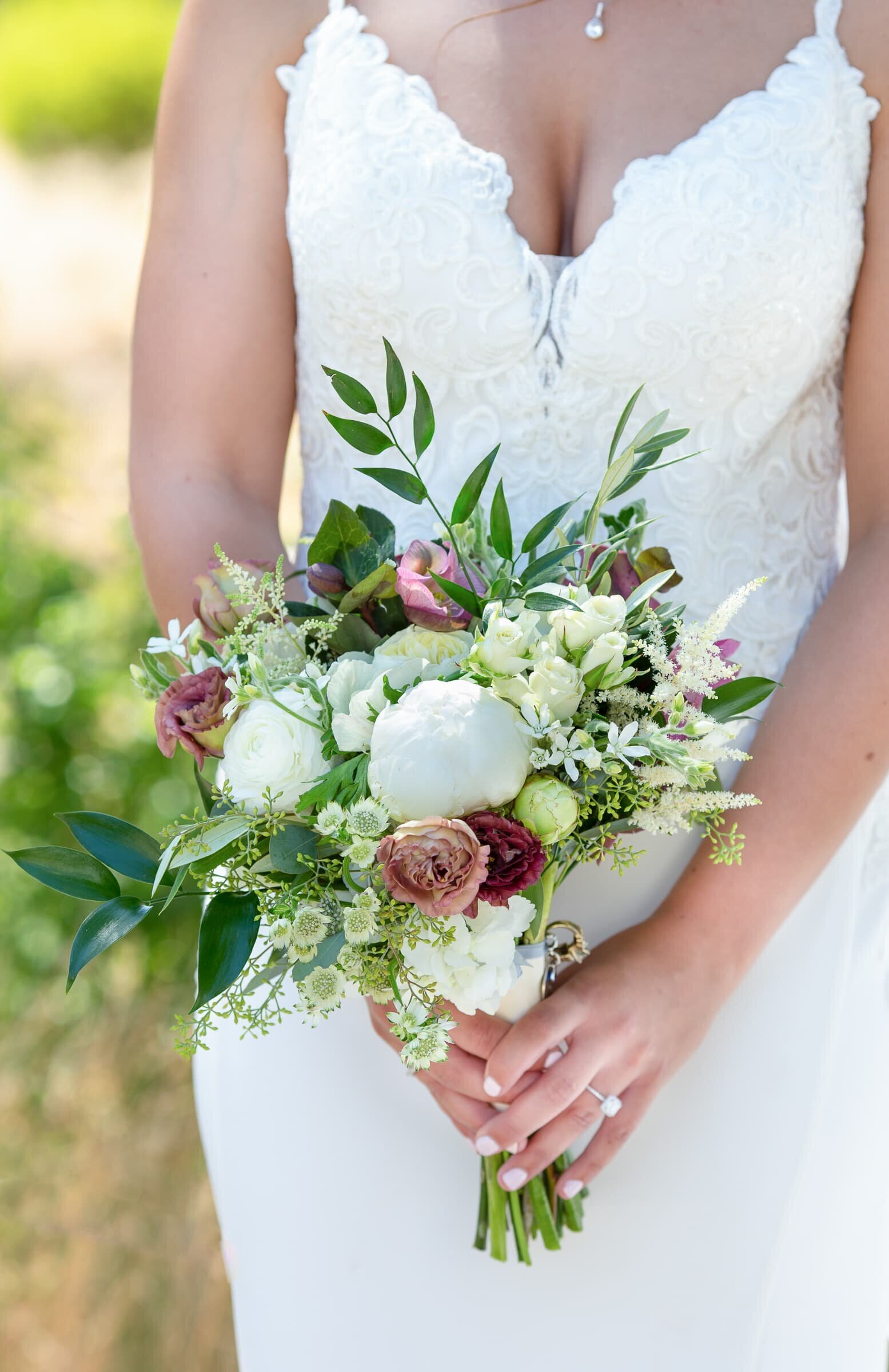 white, pink and burgundy with some greenery bridal flowers.