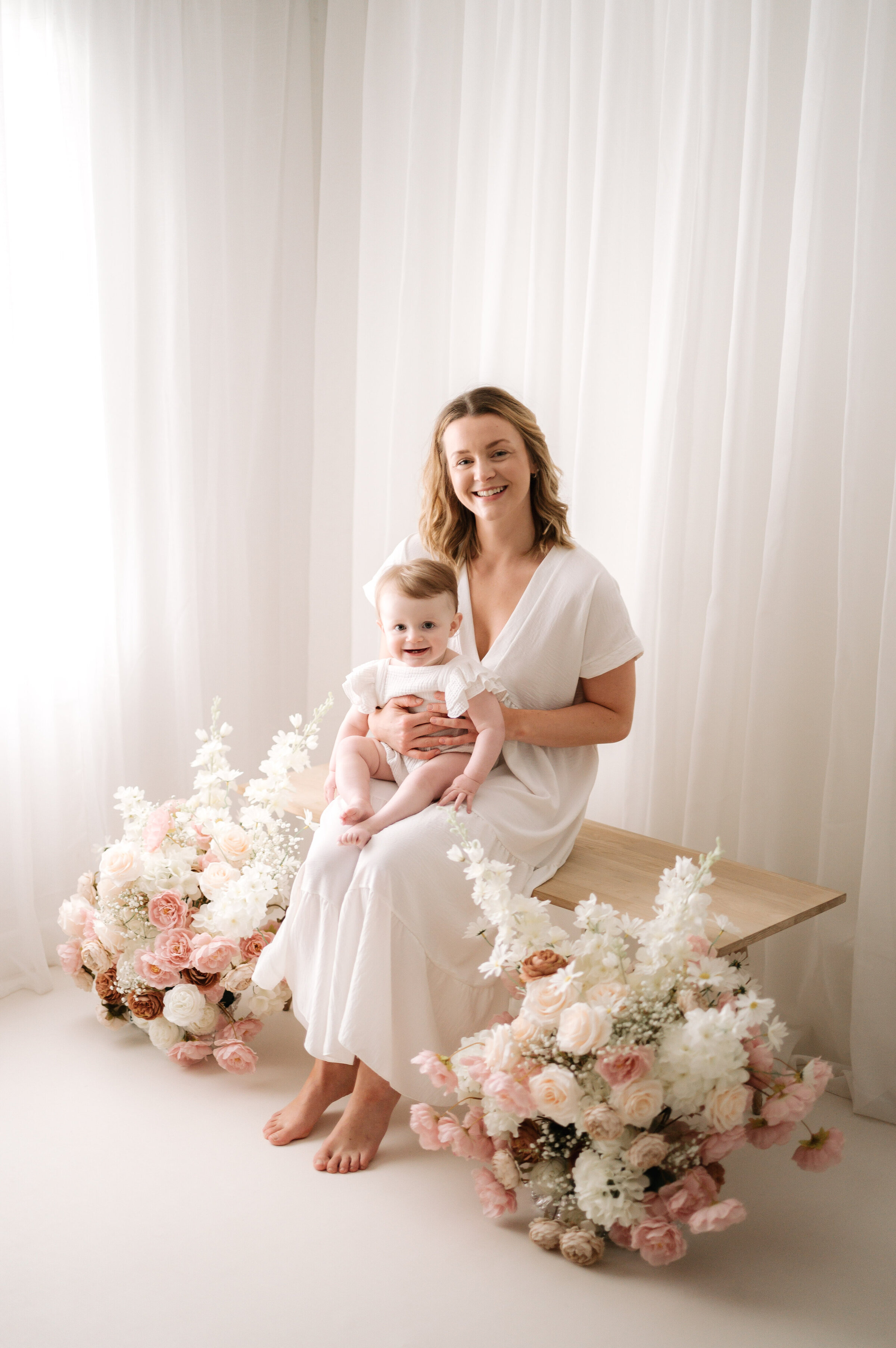 Mother holding her baby at mothers day photoshoot in Horsham