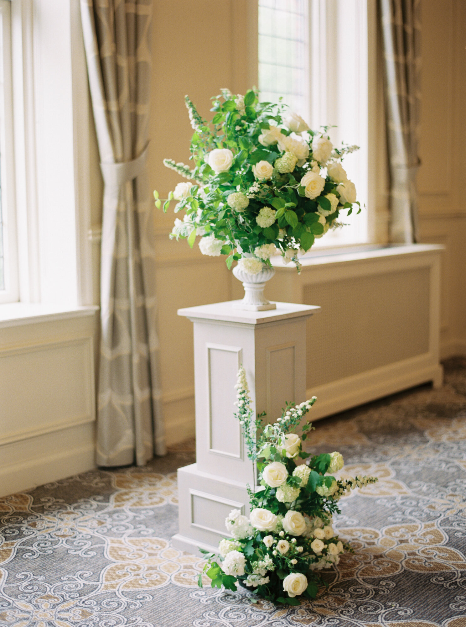 historic seattle wedding venue the rainier club ceremony in the heritage room green floral decor