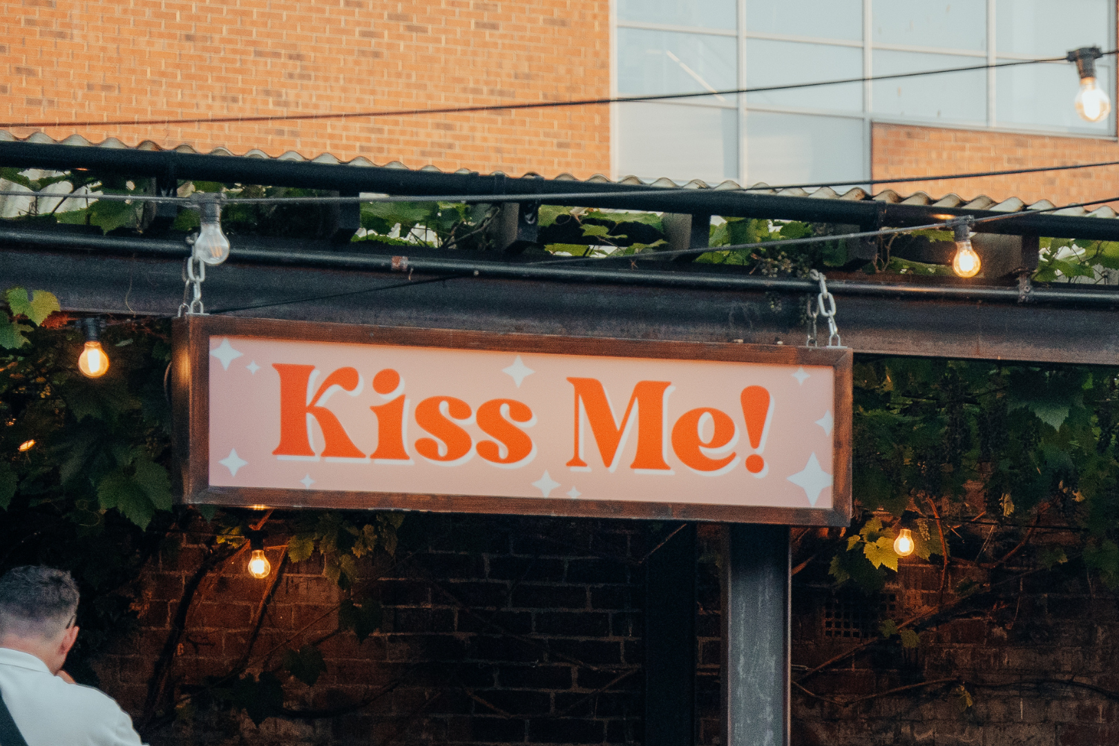 Kiss Me sign close up evening