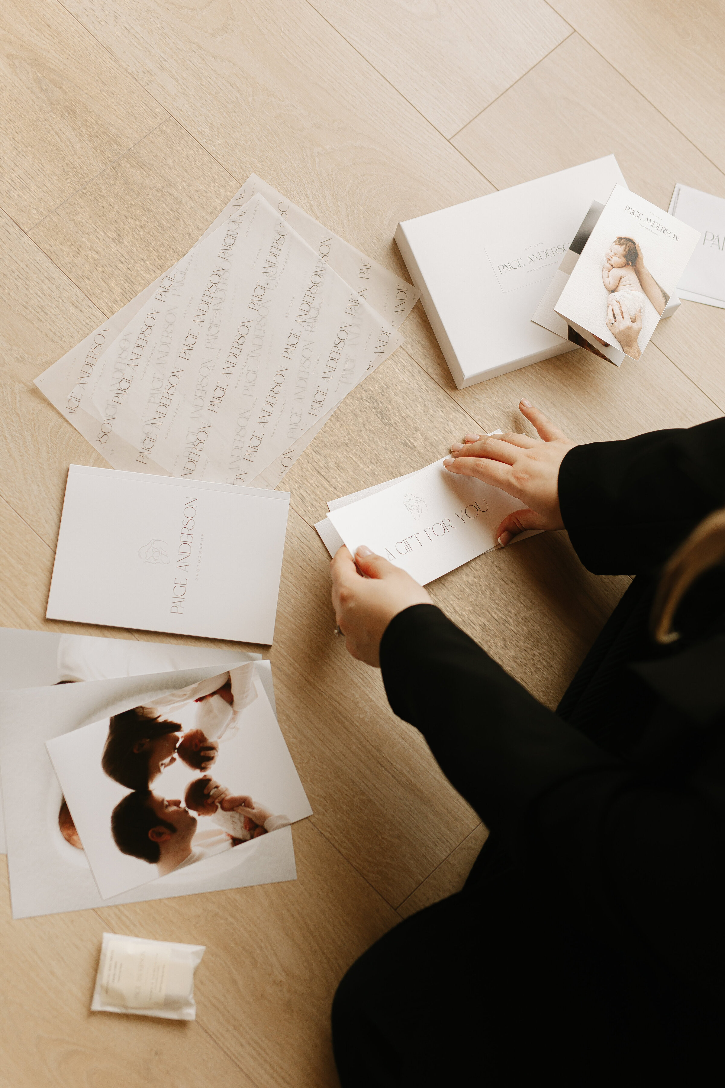 A girl looking through her packaging material at horsham photoshoot