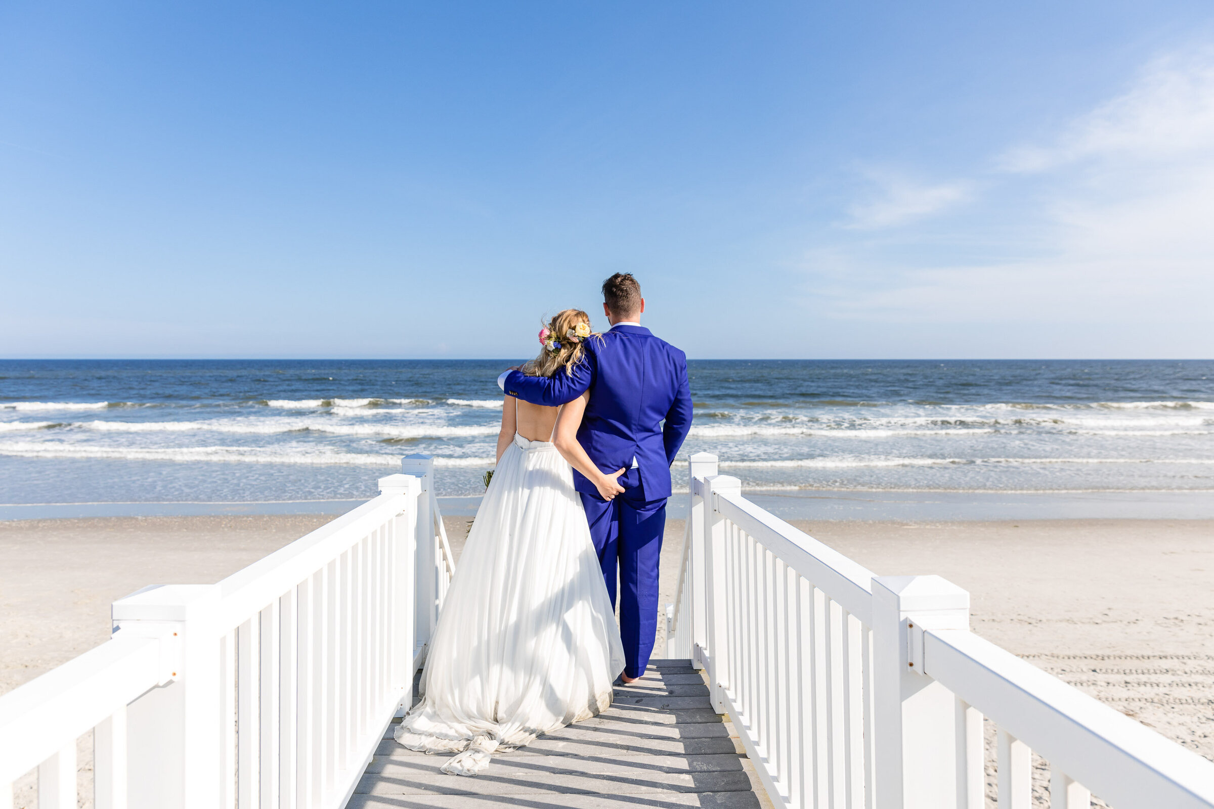 "Man and woman share a moment alone during their wedding on Ocean Isle NC"