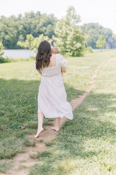 women twirling with little girl in her arms  knoxville tennessee newborn photographer