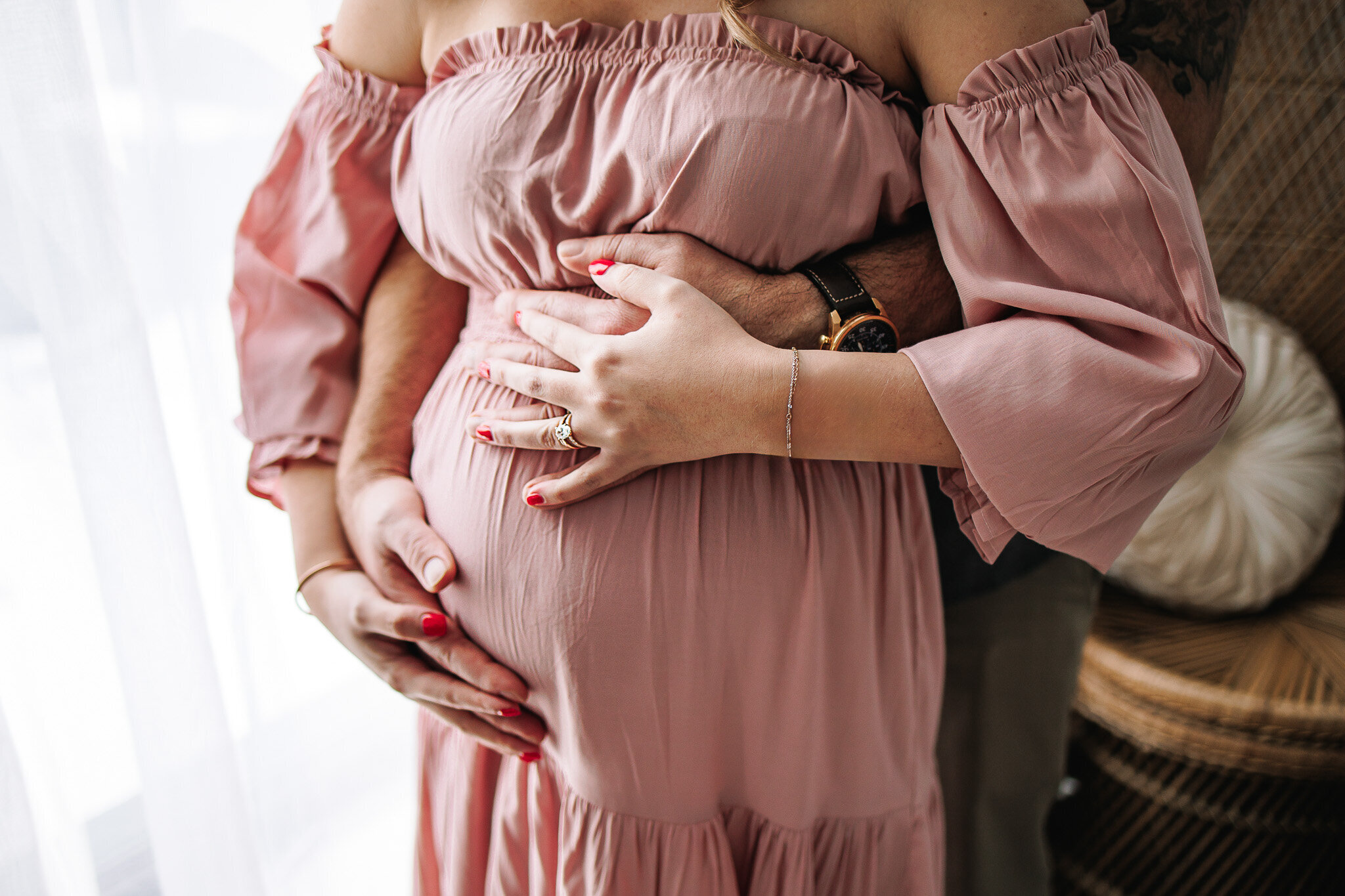 Holding pregnant belly