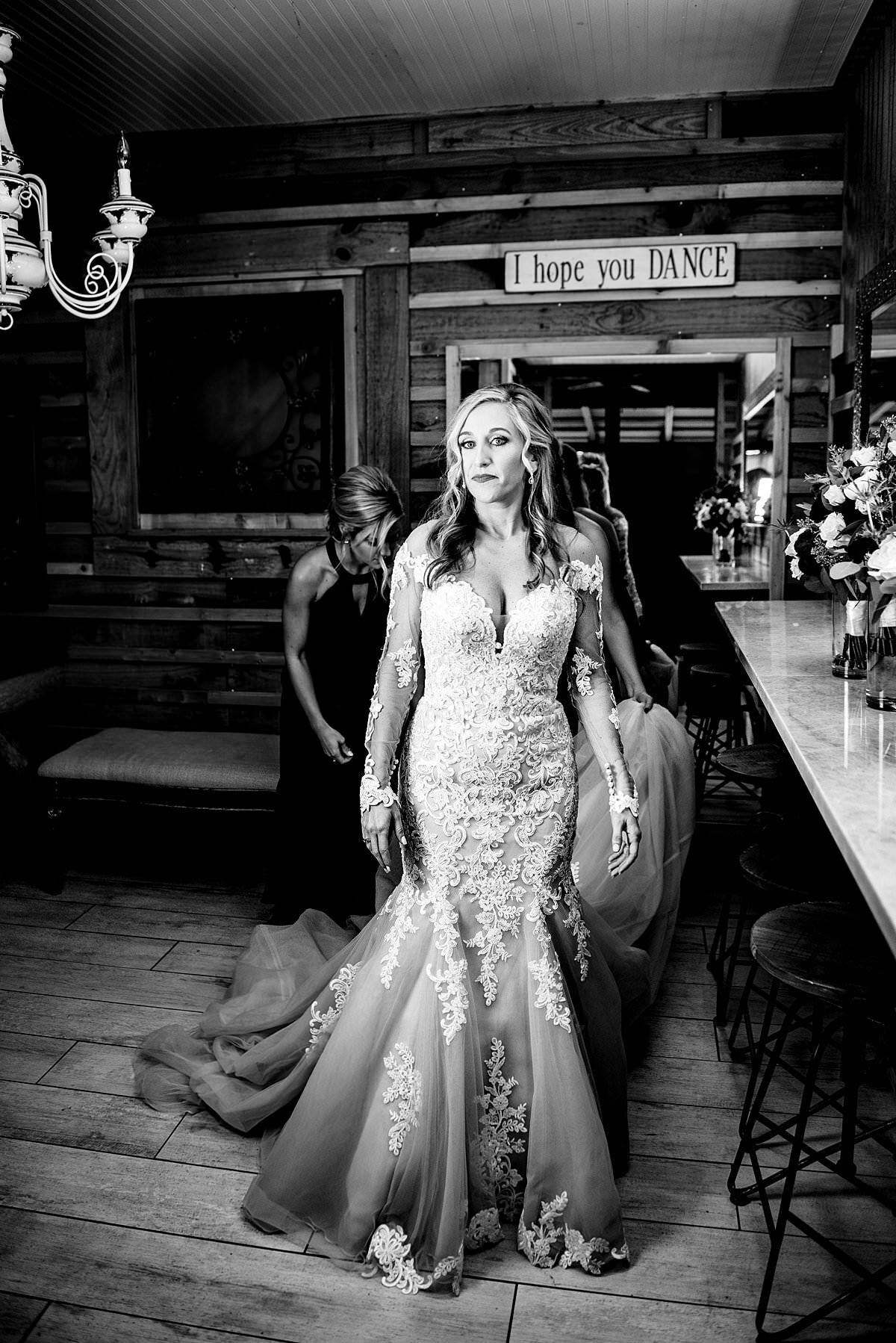Dramatic lighting of black and white photo of bride getting ready at Rural Hill Farm