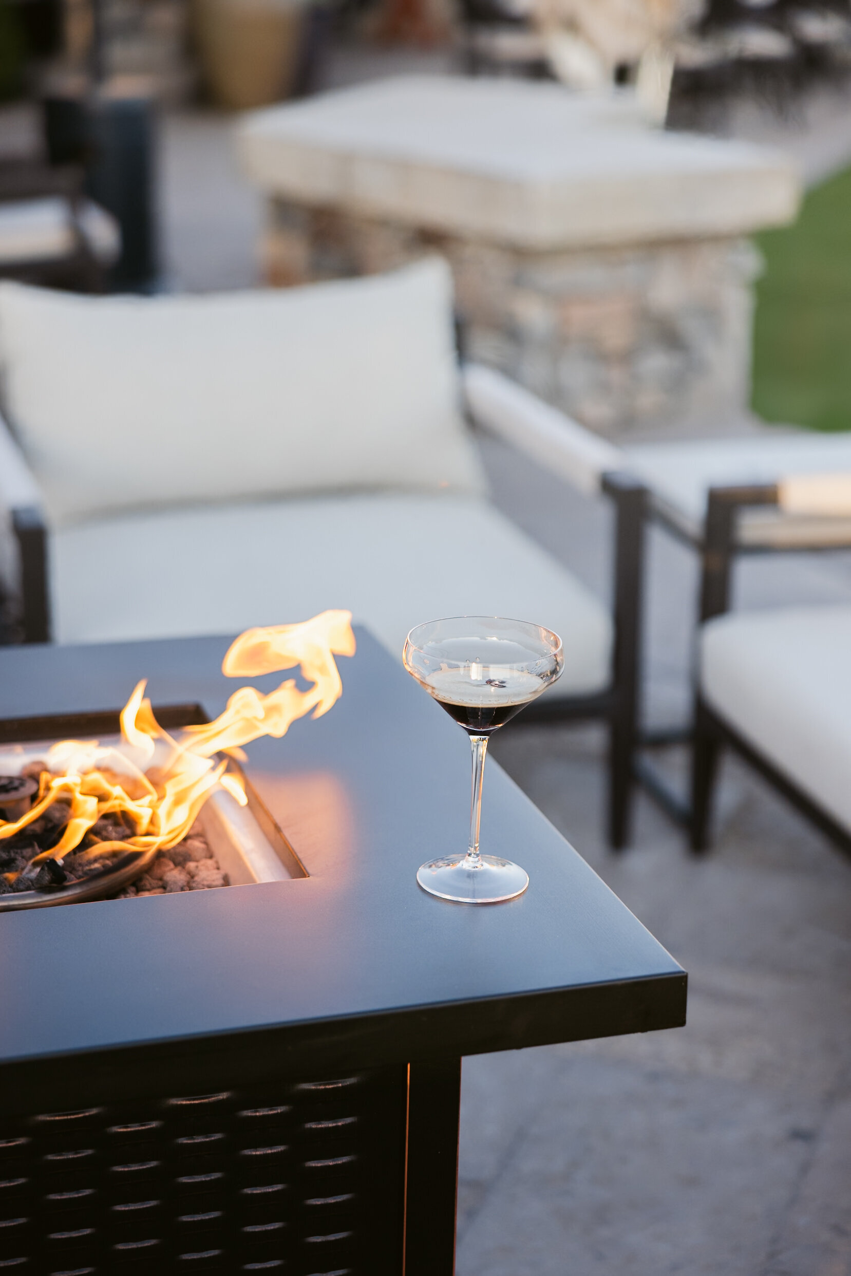 espresso martini set next to fire pit
