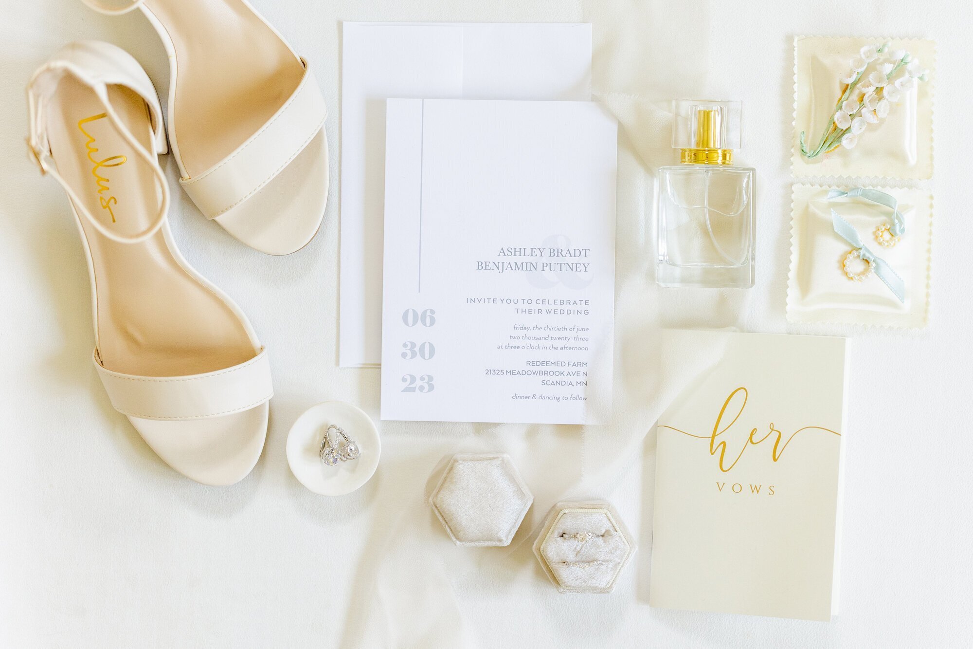 Wedding rings, invites, and shoes taken by wedding photographer minneapolis by Kacey Wyrick Photography