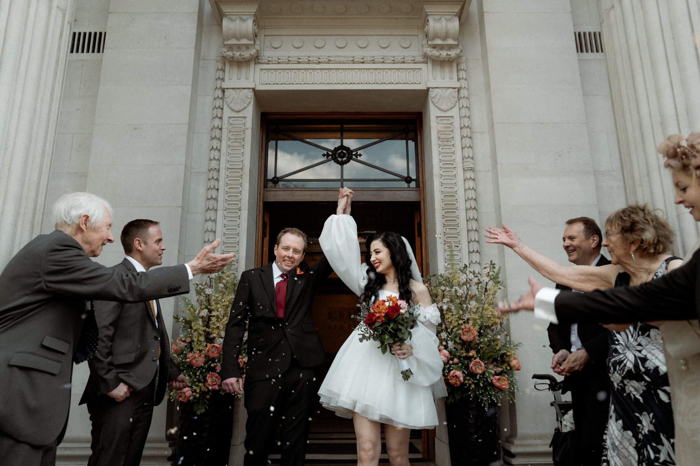 Couple posing for London wedding photographer after getting married at old marylebone town hall 03282