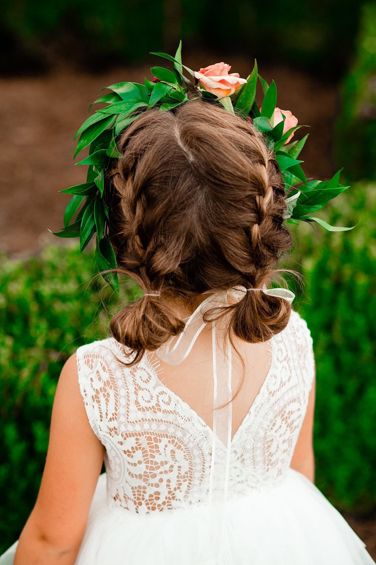 Braids and flower crown on flower girl