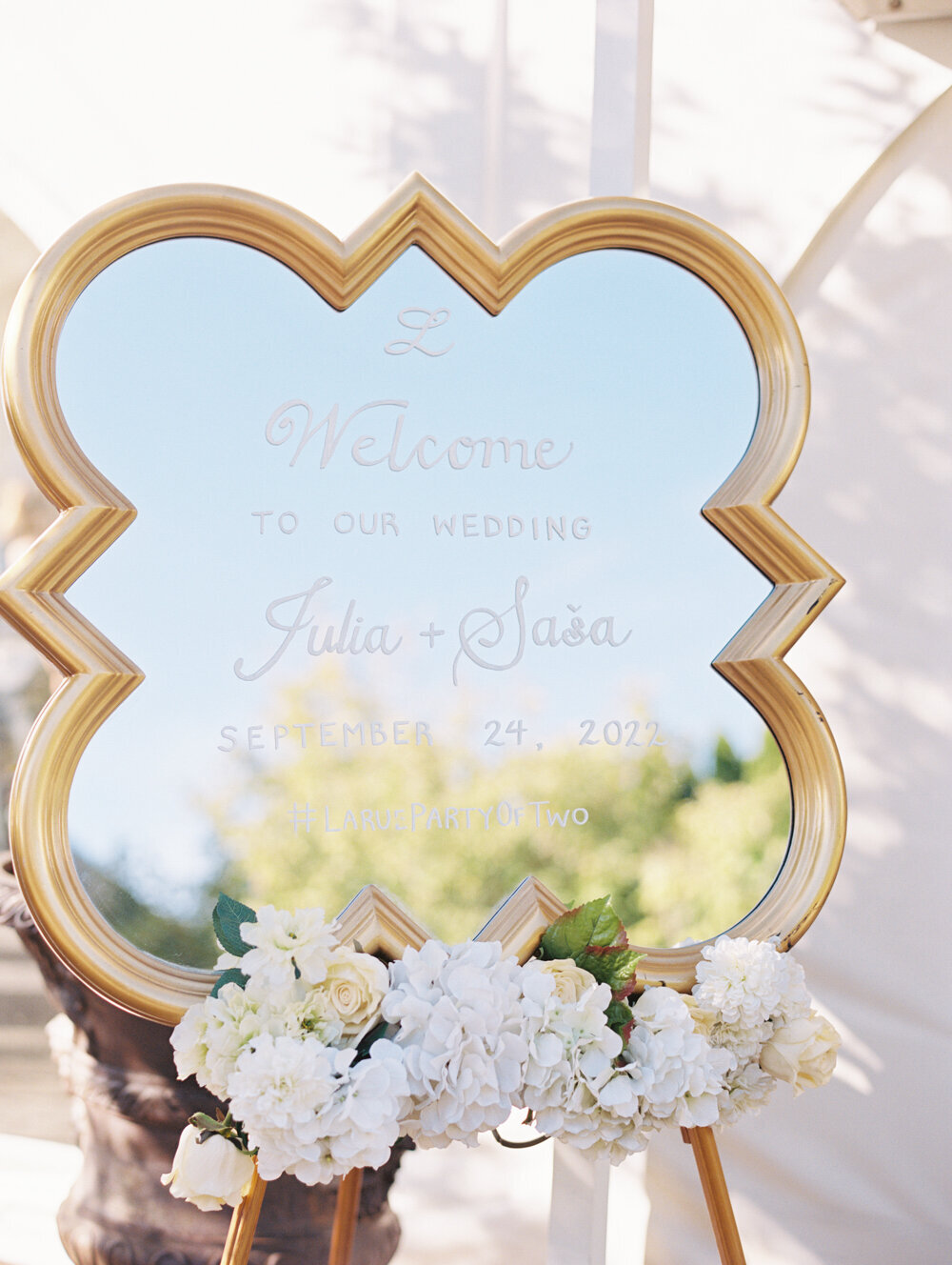 wedding decor gold welcome mirror with white writing