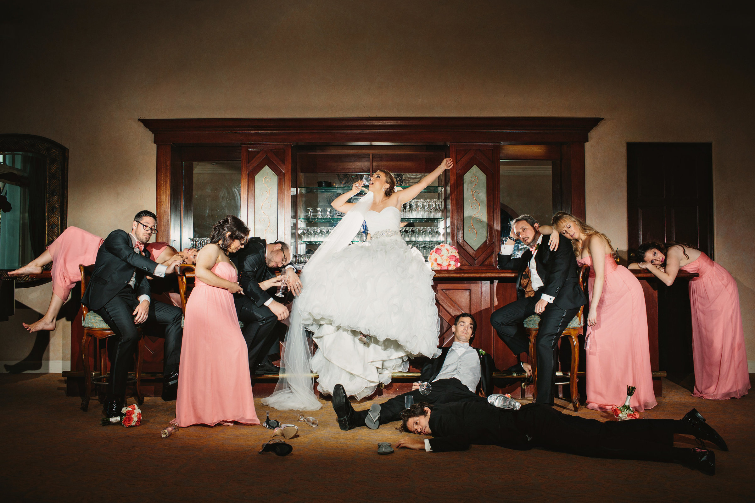 A creative and editorial wedding party photo at the bar in California wedding