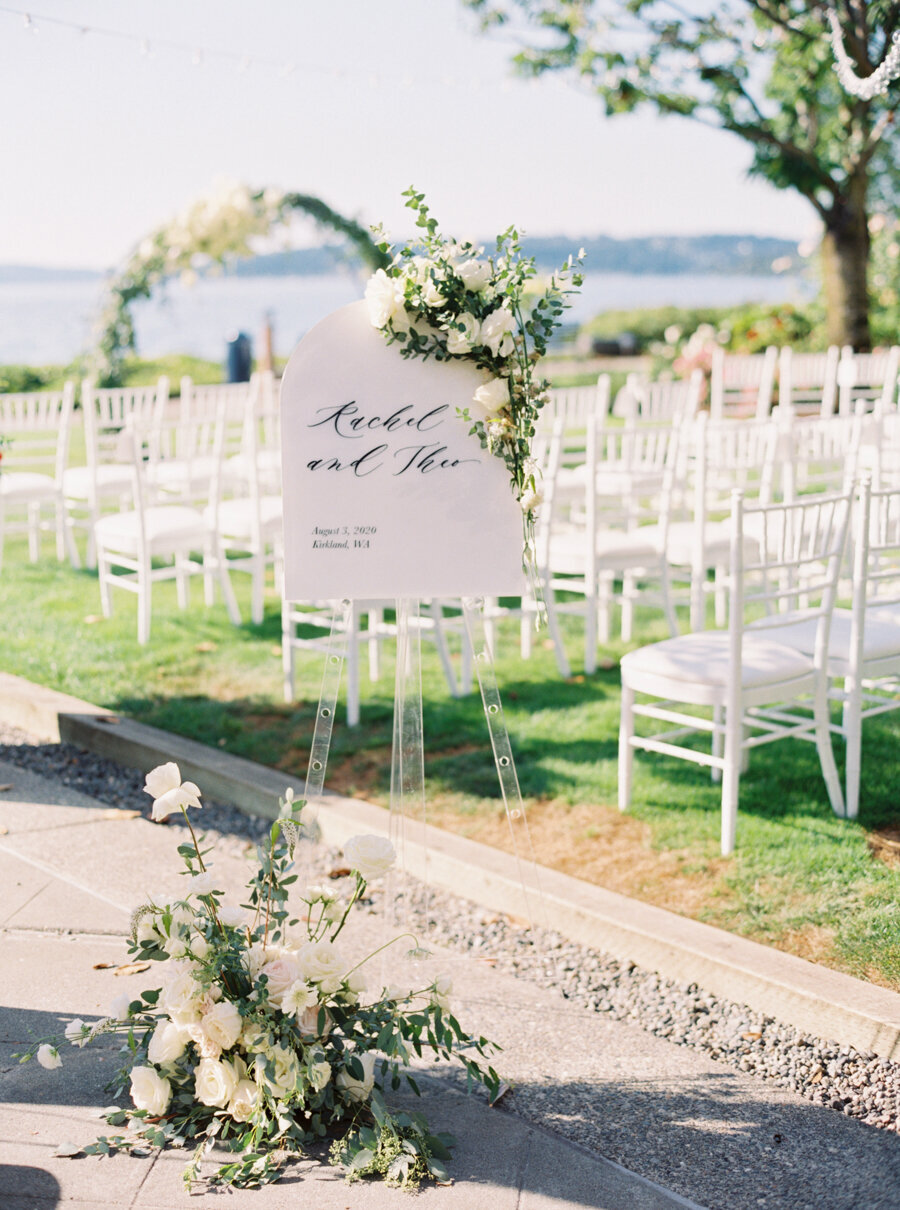 custom black and white wedding ceremony signage outside