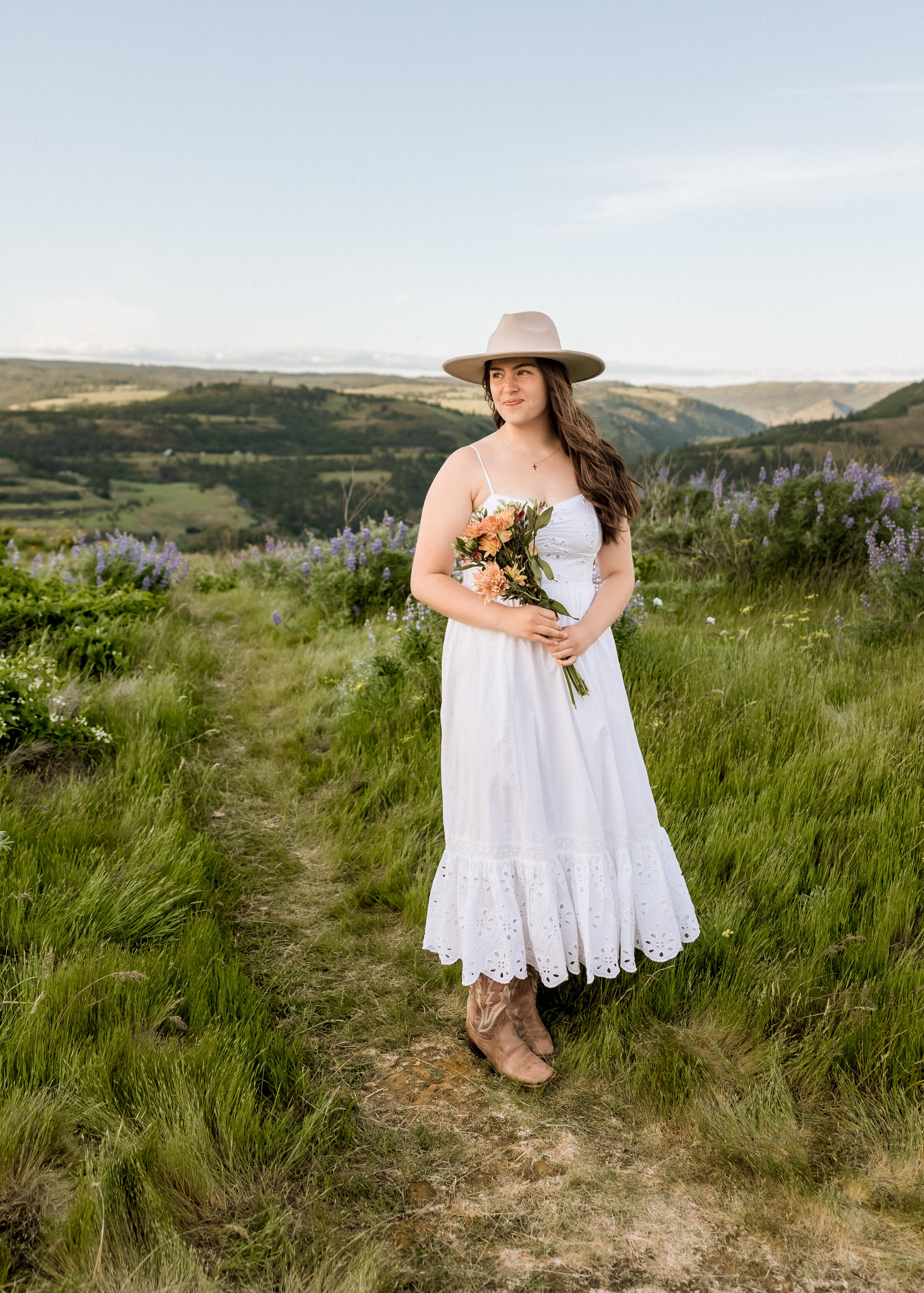 Girl walking through a field of wildflowers.